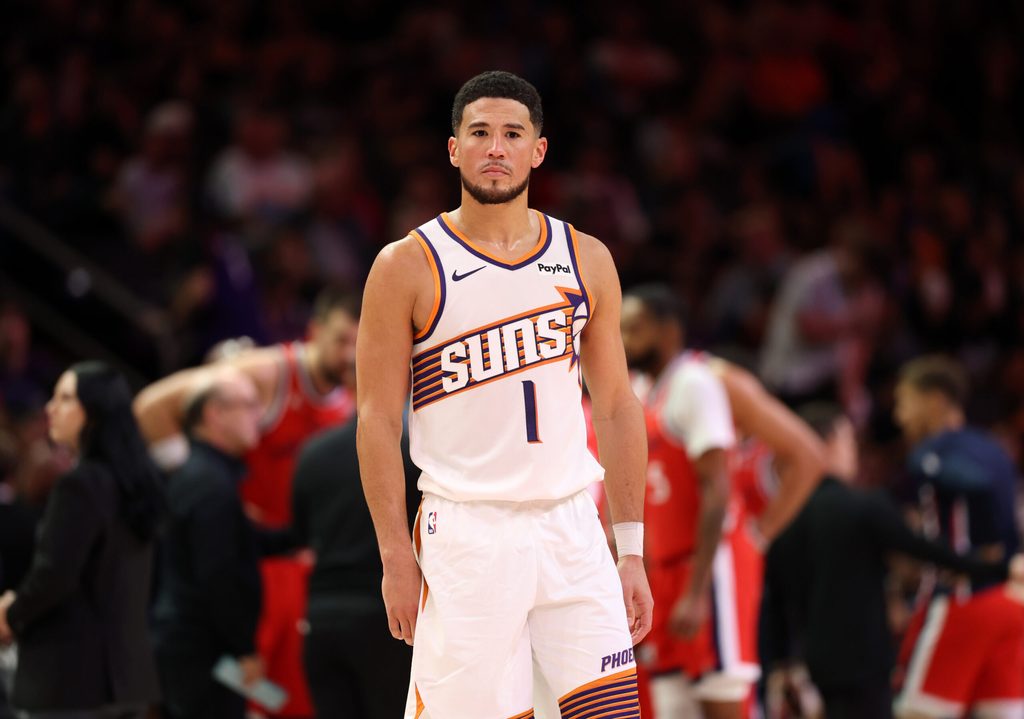 Nov 6, 2025; Phoenix, Arizona, USA; Phoenix Suns guard Devin Booker (1) against the Los Angeles Clippers in the second half at the Mortgage Matchup Center. Mandatory Credit: Mark J. Rebilas-Imagn Images