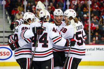 Nov 7, 2025; Calgary, Alberta, CAN; Chicago Blackhawks left wing Andre Burakovsky (28) celebrates his goal with teammates against the Calgary Flames during the third period at Scotiabank Saddledome. Mandatory Credit: Sergei Belski-Imagn Images