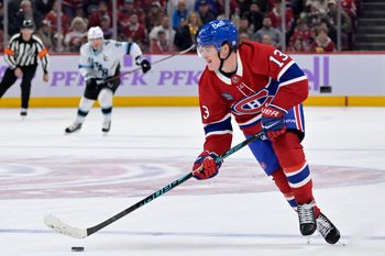 Nov 8, 2025; Montreal, Quebec, CAN; Montreal Canadiens forward Cole Caufield (13) plays the puck against the Utah Mammoth during the third period at the Bell Centre. Mandatory Credit: Eric Bolte-Imagn Images