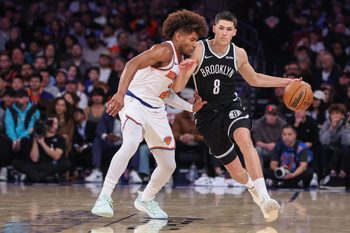 Nov 9, 2025; New York, New York, USA;  Brooklyn Nets guard Egor Demin (8) looks to drive past New York Knicks guard Miles McBride (2) in the fourth quarter at Madison Square Garden. Mandatory Credit: Wendell Cruz-Imagn Images