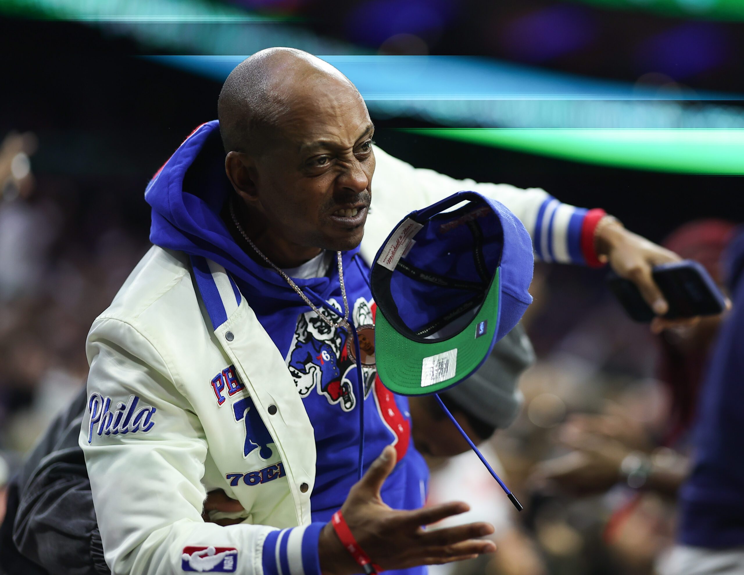 Nov 9, 2025; Philadelphia, Pennsylvania, USA; Podcaster and entertainer Gillie Da King reacts after a Philadelphia 76ers score against the Detroit Pistons during the fourth quarter at Xfinity Mobile Arena. Mandatory Credit: Bill Streicher-Imagn Images