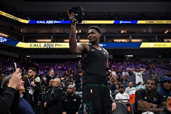 Nov 9, 2025; Sacramento, California, USA; Minnesota Timberwolves guard Anthony Edwards (5) gives his jersey to a young fan during the fourth quarter against the Sacramento Kings at Golden 1 Center. Mandatory Credit: Justine Willard-Imagn Images