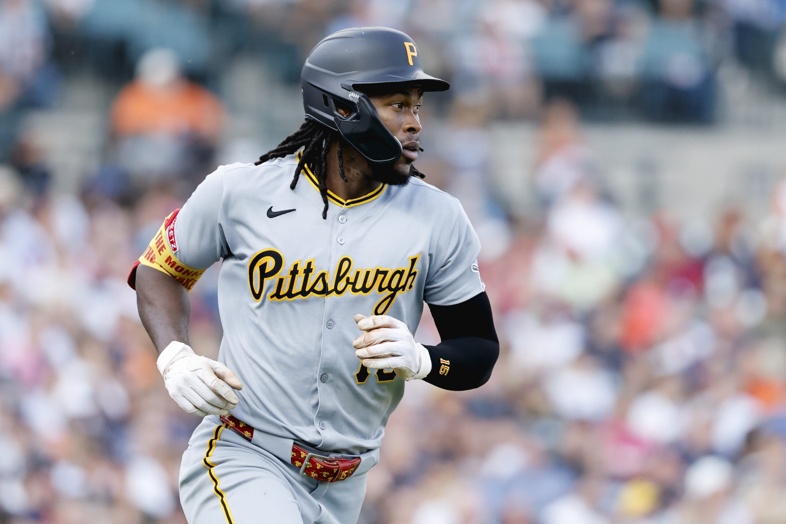 Jun 17, 2025; Detroit, Michigan, USA;  Pittsburgh Pirates outfielder Oneil Cruz (15) runs to first after hitting a single in the fourth inning against the Detroit Tigers at Comerica Park. Mandatory Credit: Rick Osentoski-Imagn Images