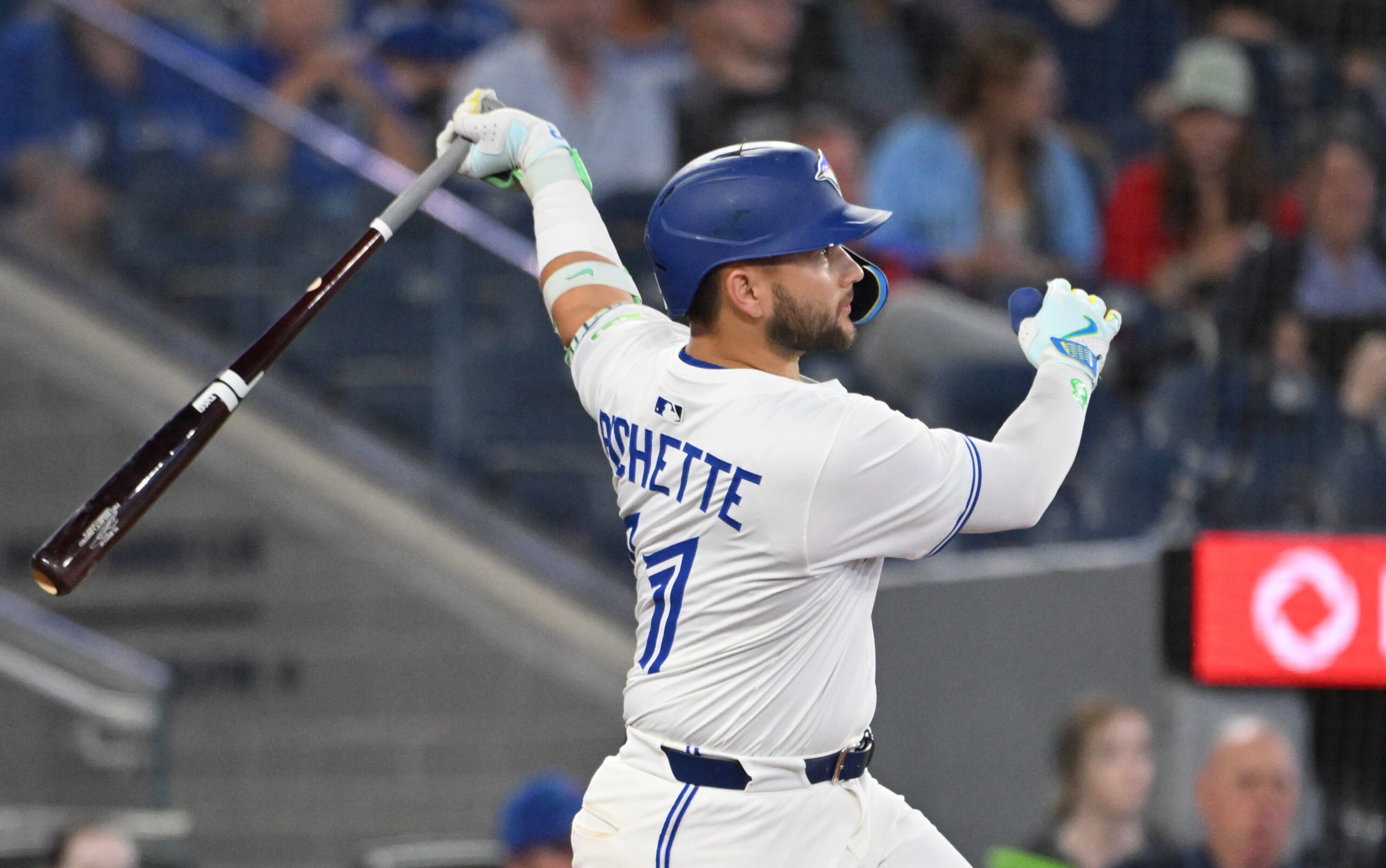 Jun 17, 2025; Toronto, Ontario, CAN;   Toronto Blue Jays shortstop Bo Bichette (11) hits a solo home run against the Arizona Diamondbacks in the ninth inning at Rogers Centre. Mandatory Credit: Dan Hamilton-Imagn Images