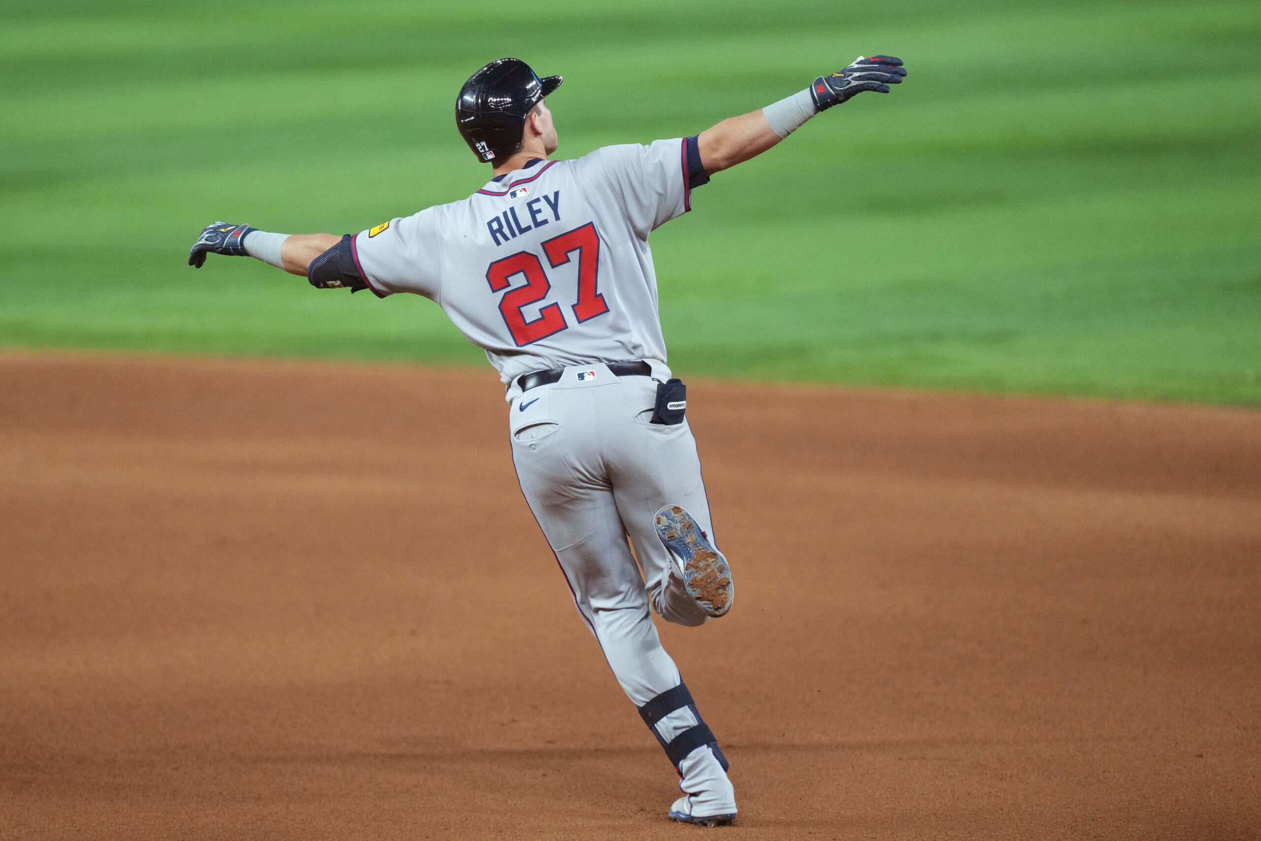 Jun 20, 2025; Miami, Florida, USA;  Atlanta Braves third baseman Austin Riley (27) rounds the bases after hitting a home run in the eighth inning against the Miami Marlins at loanDepot Park. Mandatory Credit: Jim Rassol-Imagn Images