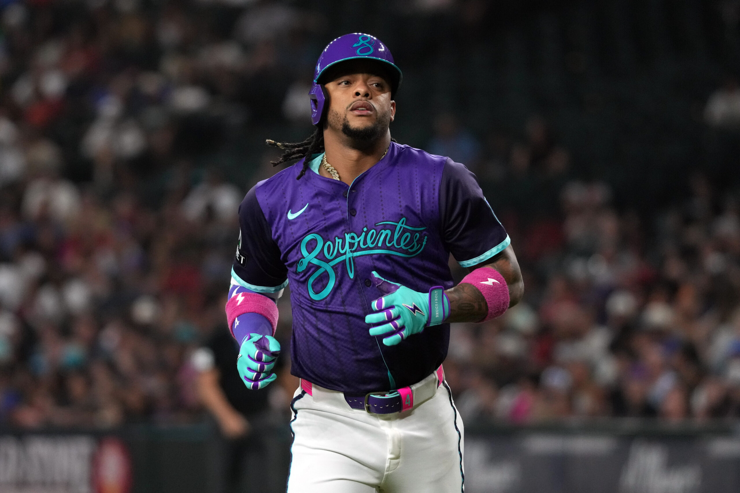 Jun 27, 2025; Phoenix, Arizona, USA; Arizona Diamondbacks second base Ketel Marte (4) runs back to the dugout against the Miami Marlins in the first inning at Chase Field. Mandatory Credit: Rick Scuteri-Imagn Images