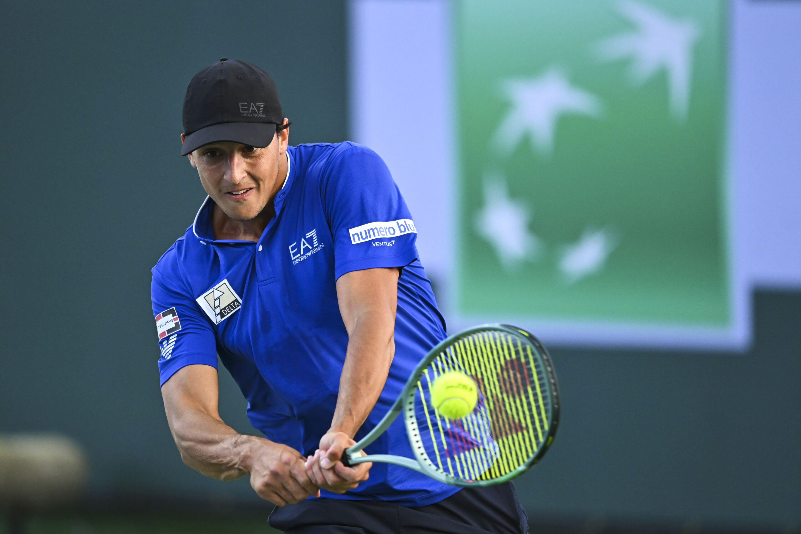 Mar 6, 2025; Indian Wells, CA, USA; Luciano Darderi (ITA) hits a ball against Hugo Gaston (FRA) in the BNP Paribas Open at the Indian Well Tennis Garden. Mandatory Credit: Jonathan Hui-Imagn Images