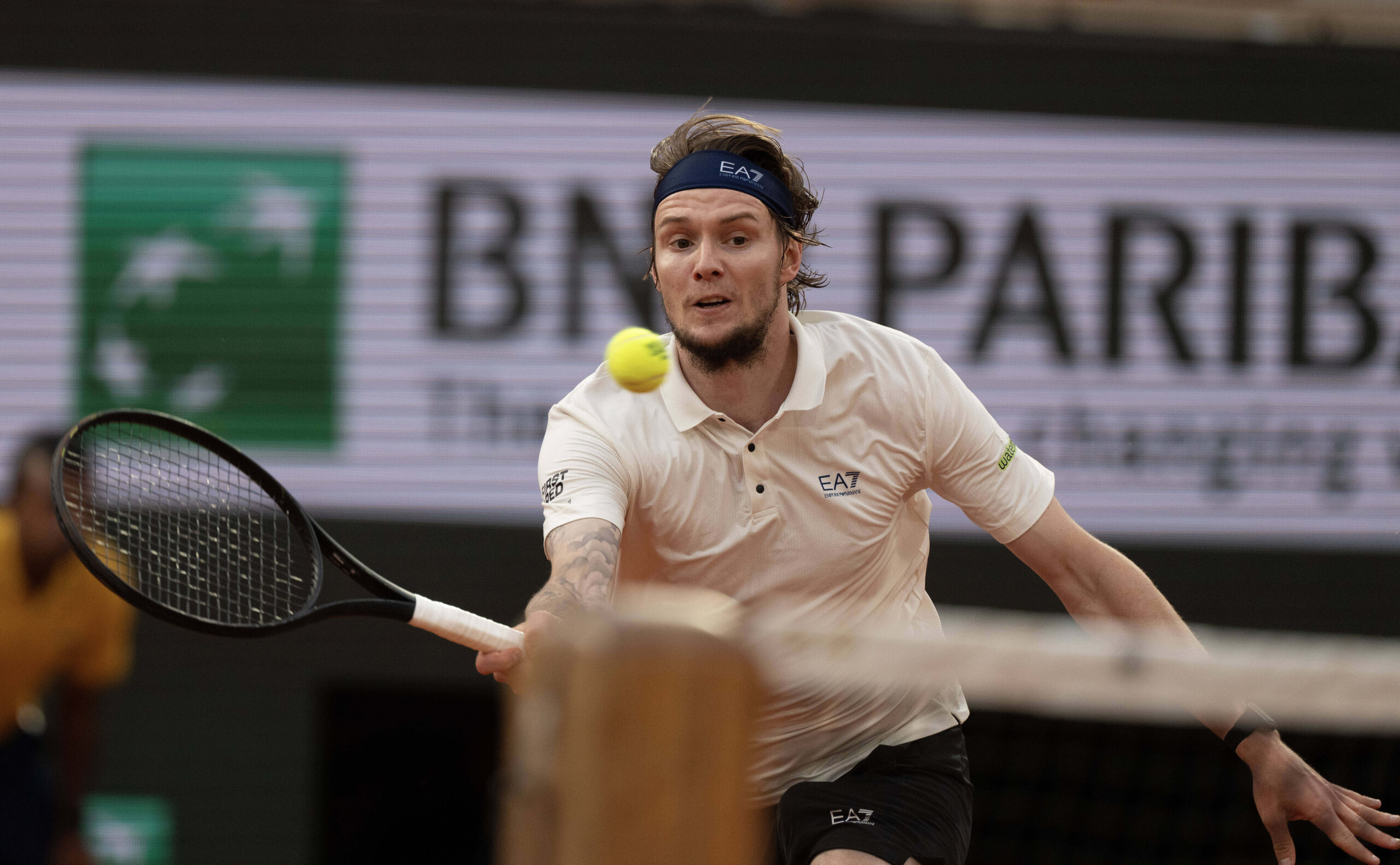 Jun 4, 2025; Paris, FR; Alexander Bublik of Kazakhstan returns a shot during his match against Jannik Sinner of Italy on day 11 at Roland Garros Stadium. Mandatory Credit: Susan Mullane-Imagn Images