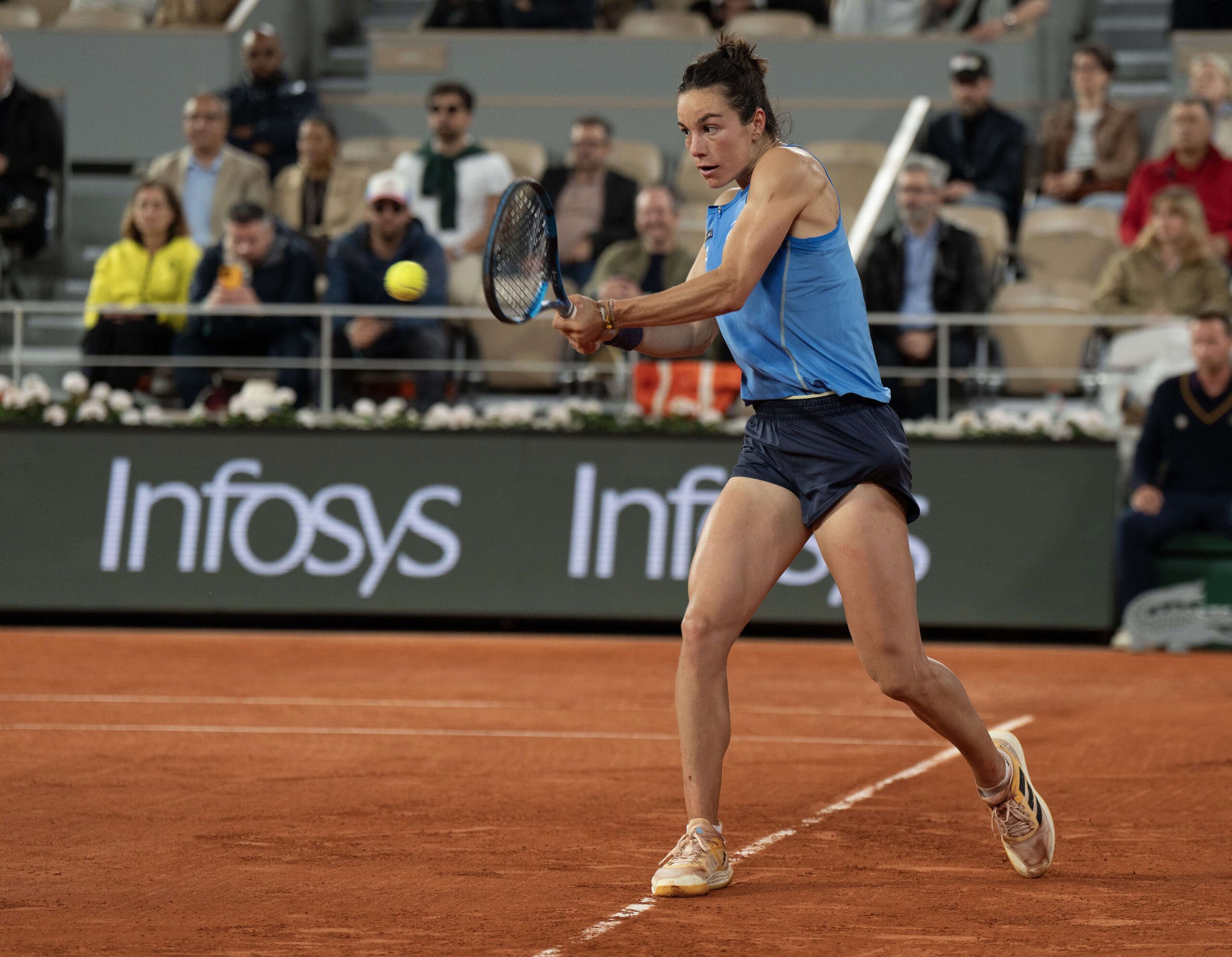 Jun 5, 2025; Paris, FR;  Lois Boisson of France returns a shot during her match against Coco Gauff of the United States on day 12 at Roland Garros Stadium. Mandatory Credit: Susan Mullane-Imagn Images