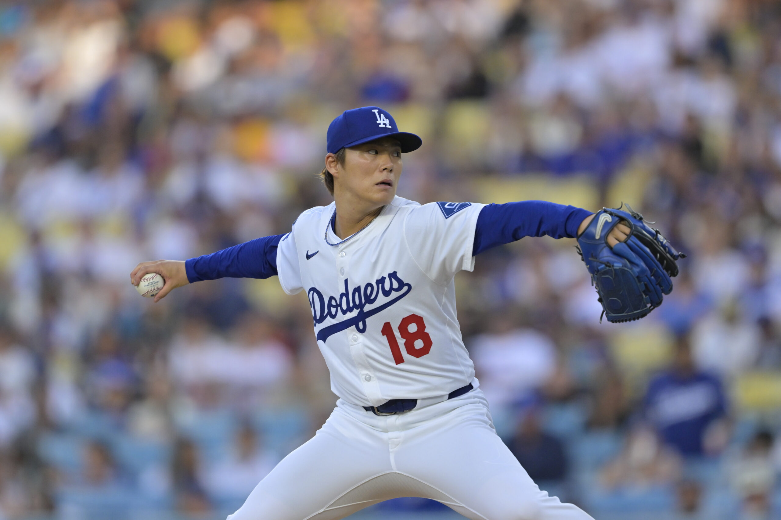 Jun 19, 2025; Los Angeles, California, USA;  Los Angeles Dodgers pitcher Yoshinobu Yamamoto (18) delivers a pitch during the first inning against the San Diego Padres at Dodger Stadium. Mandatory Credit: Jayne Kamin-Oncea-Imagn Images