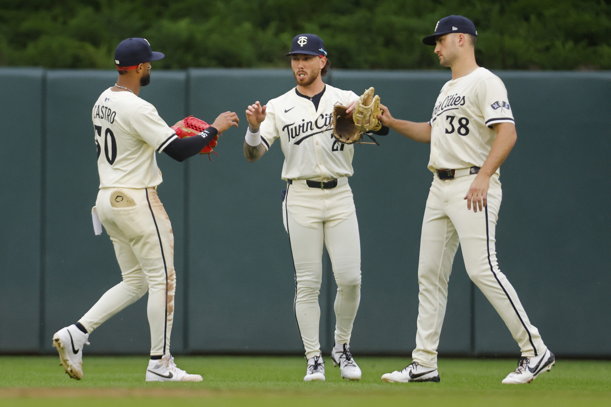 Jun 26, 2025; Minneapolis, Minnesota, USA; Minnesota Twins left fielder Willi Castro (50)  center fielder DaShawn Keirsey (21) and right fielder Matt Wallner (38) celebrate the win over the Seattle Mariners at Target Field. Mandatory Credit: Bruce Kluckhohn-Imagn Images