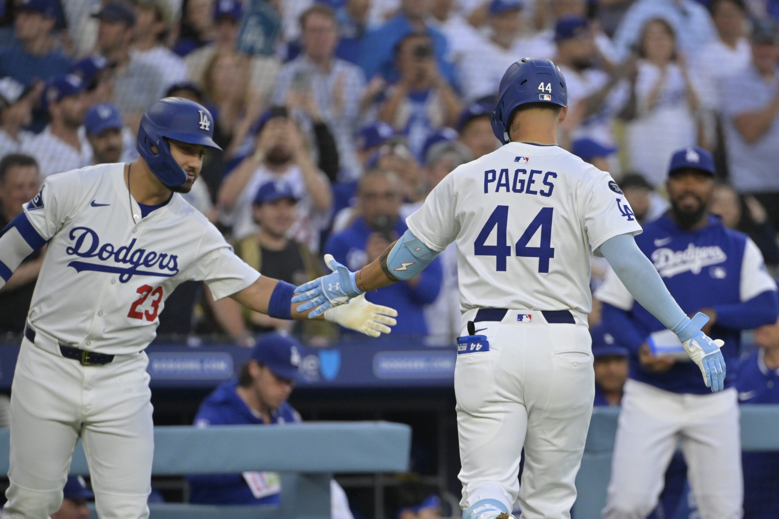 Jul 2, 2025; Los Angeles, California, USA;  Los Angeles Dodgers outfielder Michael Conforto (23) greets outfielder Andy Pages (44) after hitting solo home run during the second inning against the Chicago White Sox at Dodger Stadium. Mandatory Credit: Jayne Kamin-Oncea-Imagn Images