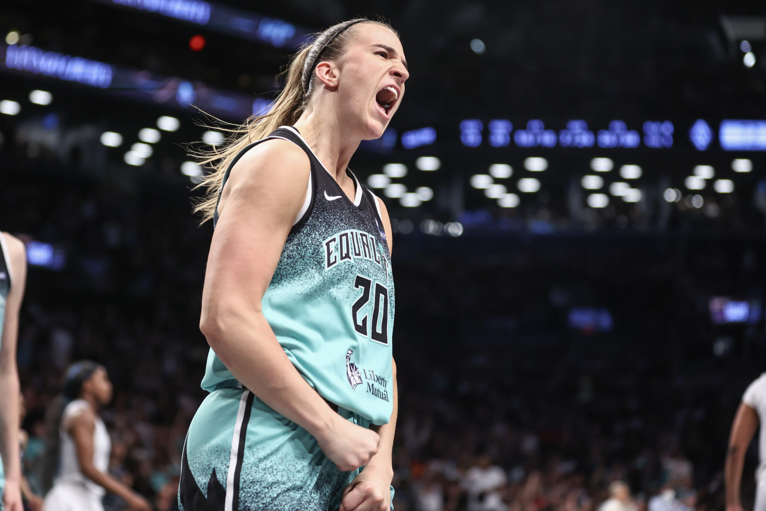 Jul 8, 2025; Brooklyn, New York, USA;  New York Liberty guard Sabrina Ionescu (20) celebrates after scoring in the fourth quarter against the Las Vegas Aces at Barclays Center. Mandatory Credit: Wendell Cruz-Imagn Images