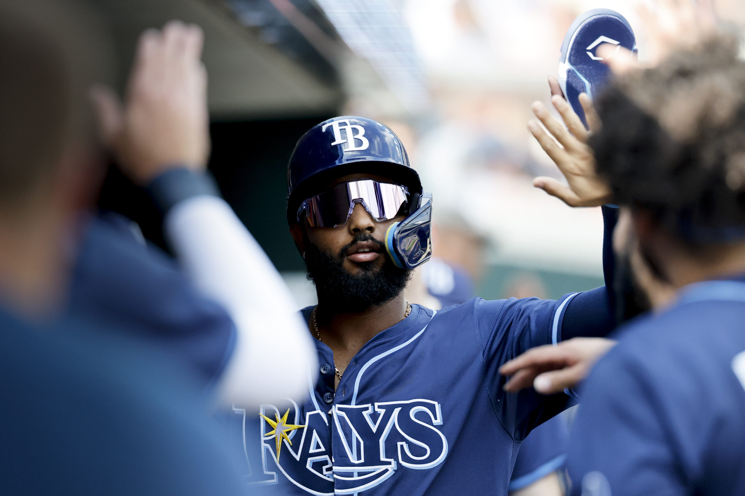 Jul 9, 2025; Detroit, Michigan, USA;  Tampa Bay Rays third baseman Junior Caminero (13) receives congratulations from teammates after scoring in the first inning against the Detroit Tigers at Comerica Park. Mandatory Credit: Rick Osentoski-Imagn Images