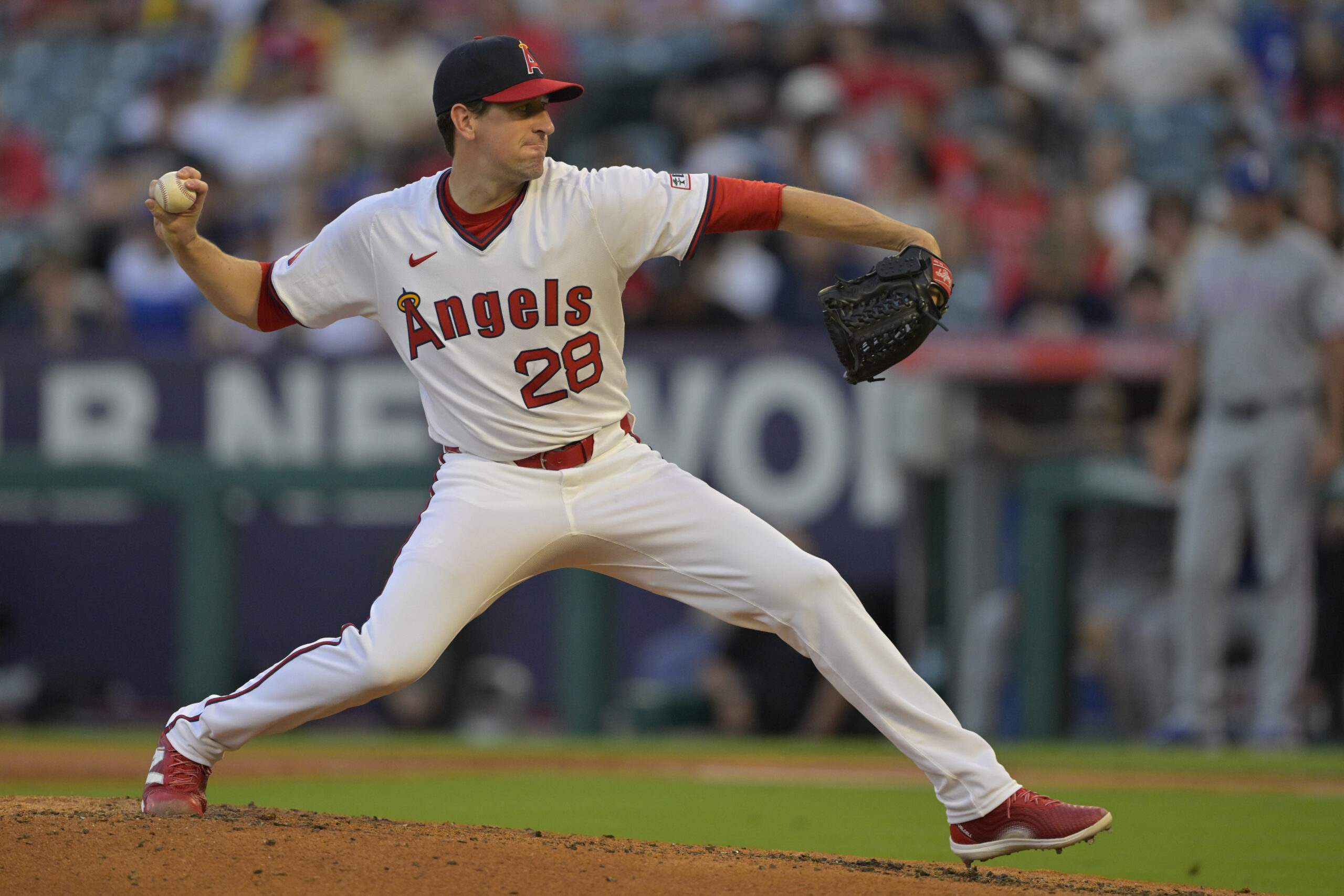 Jul 9, 2025; Anaheim, California, USA; Los Angeles Angels starting pitcher Kyle Hendricks (28) delivers in the fourth inning against the Texas Rangers at Angel Stadium. Mandatory Credit: Jayne Kamin-Oncea-Imagn Images