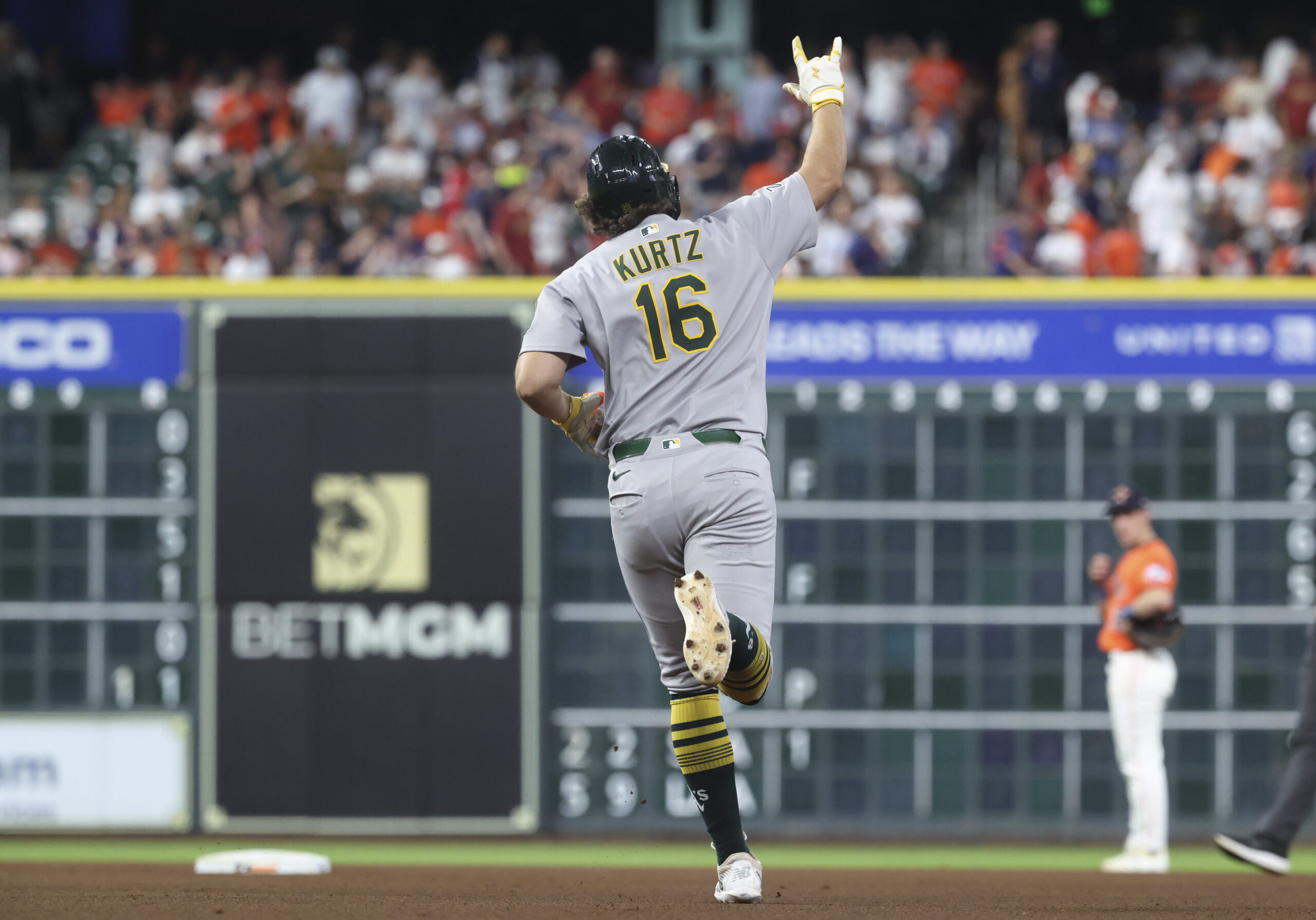 Jul 25, 2025; Houston, Texas, USA; Athletics designated hitter Nick Kurtz (16) celebrates after hitting a home run during the sixth inning against the Houston Astros at Daikin Park. Mandatory Credit: Troy Taormina-Imagn Images
