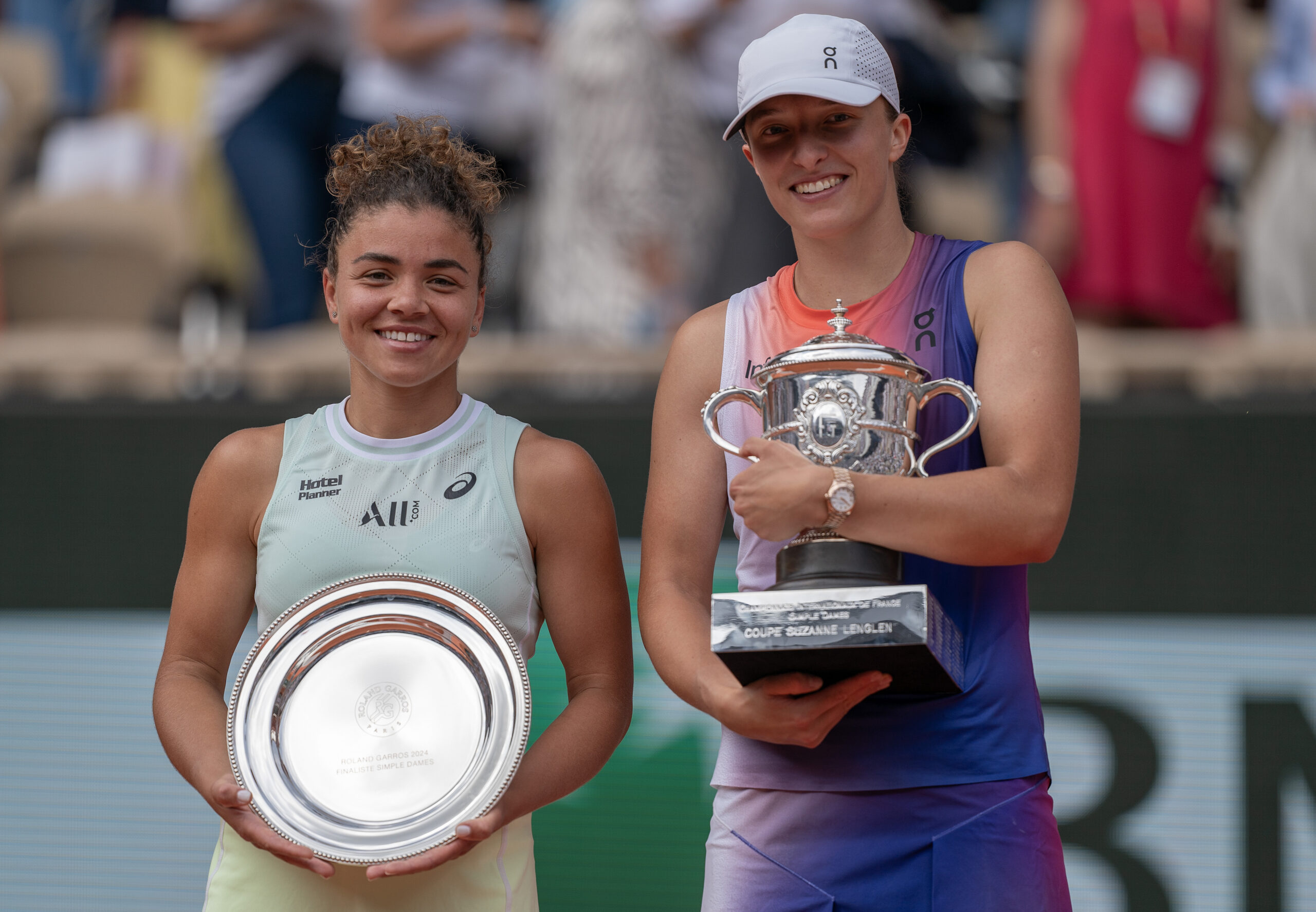 Jun 8, 2024; Paris, France; Iga Swiatek of Poland and Jasmine Paolini of Italy pose with their trophies after the womenís final on day 14 of Roland Garros at Stade Roland Garros. Mandatory Credit: Susan Mullane-Imagn Images