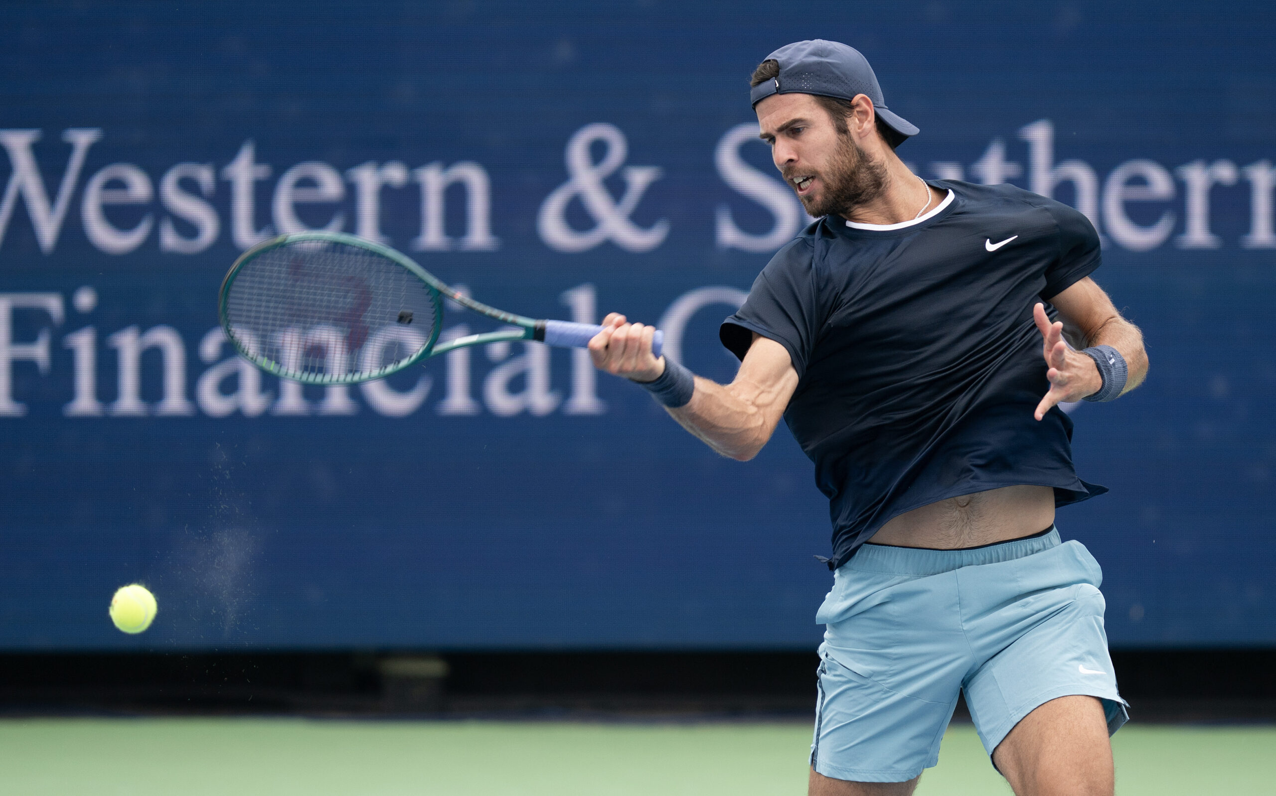 Aug 15, 2024; Cincinnati, OH, USA ; Karen Khachanov returns a shot against  Alexander Zverev of Germany on day four of the Cincinnati Open. Mandatory Credit: Susan Mullane-Imagn Images