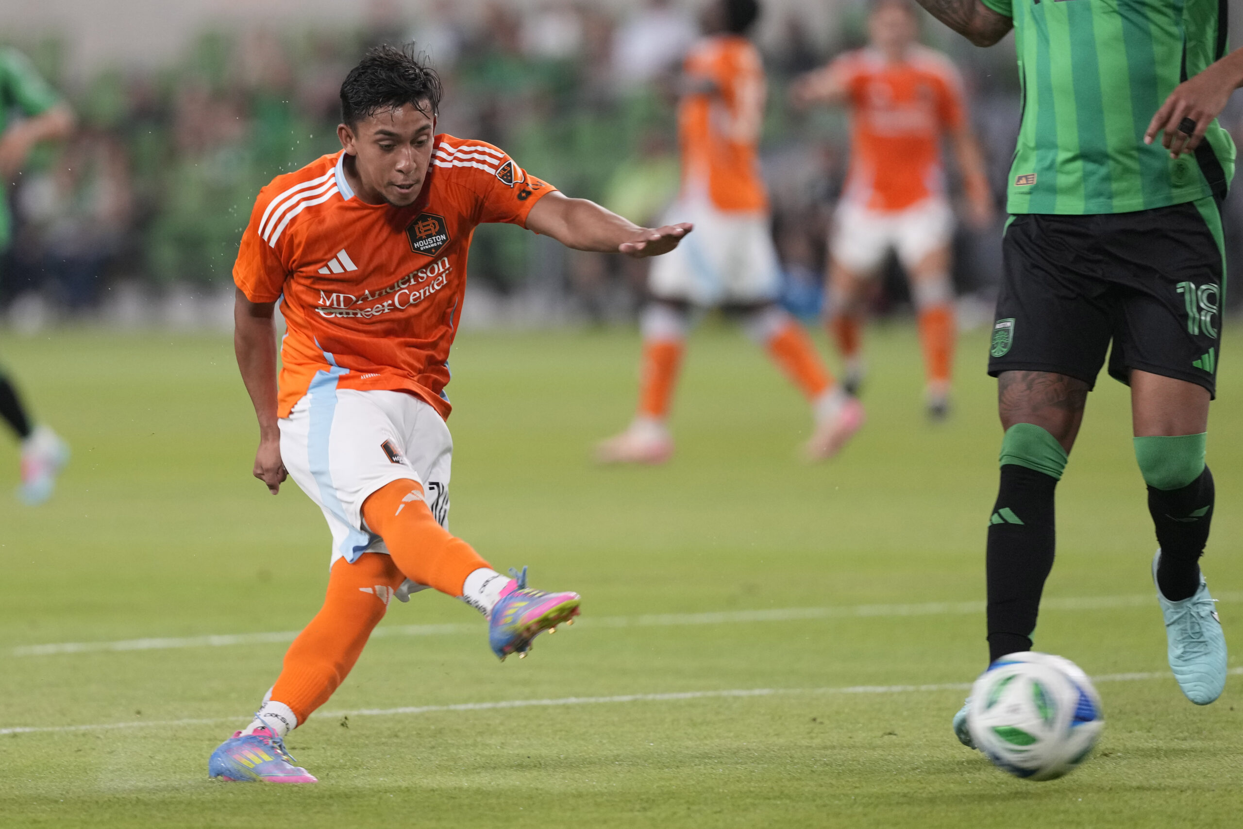May 21, 2025; Austin, Texas, USA; Houston FC midfielder Erik Duenas (16) shoots on goal during the second half against Austin FC at Q2 Stadium. Mandatory Credit: Scott Wachter-Imagn Images