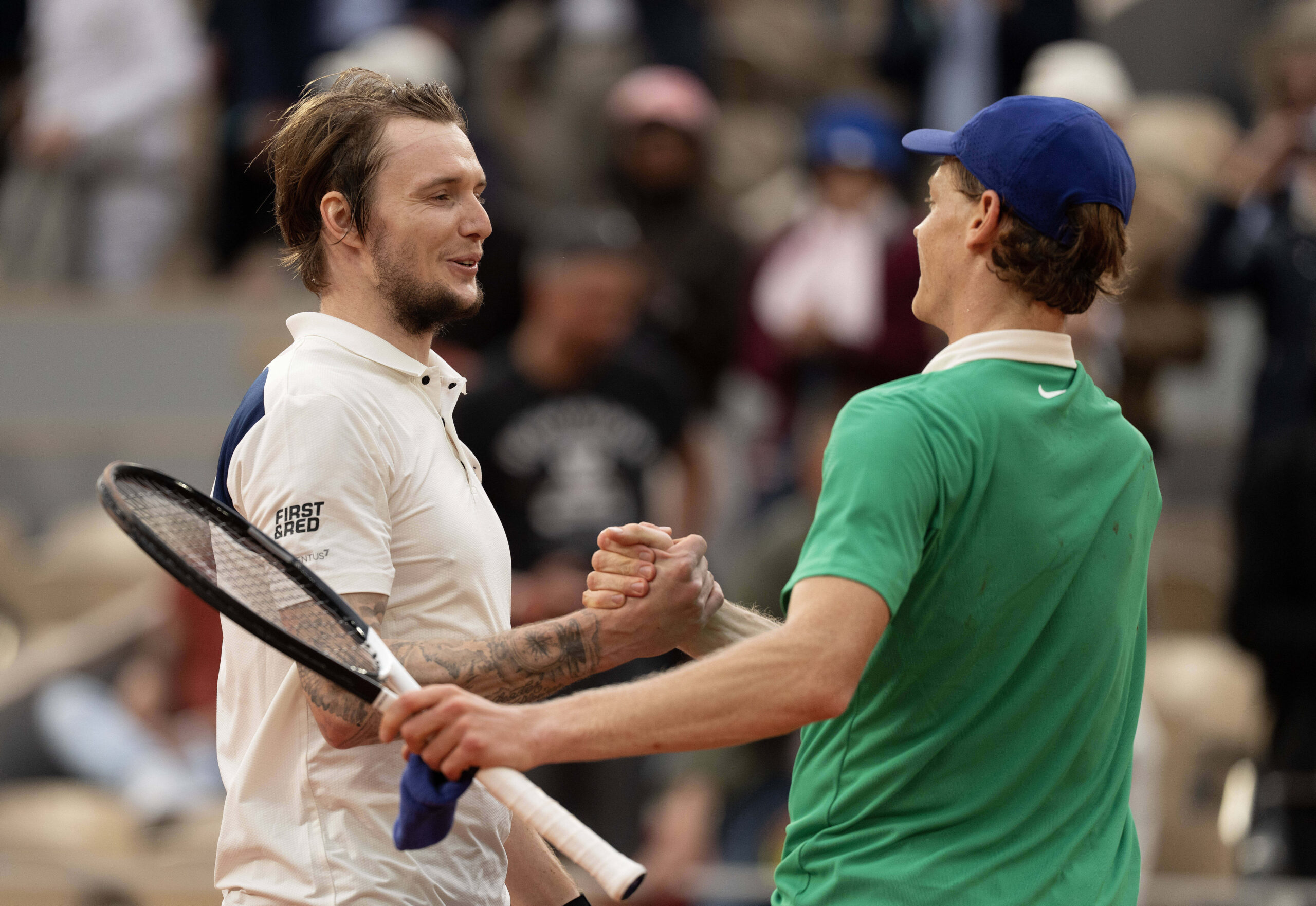 Jun 4, 2025; Paris, FR; Jannik Sinner of Italy at the net with Alexander Bublik of Kazakhstan after their match on day 11 at Roland Garros Stadium. Mandatory Credit: Susan Mullane-Imagn Images