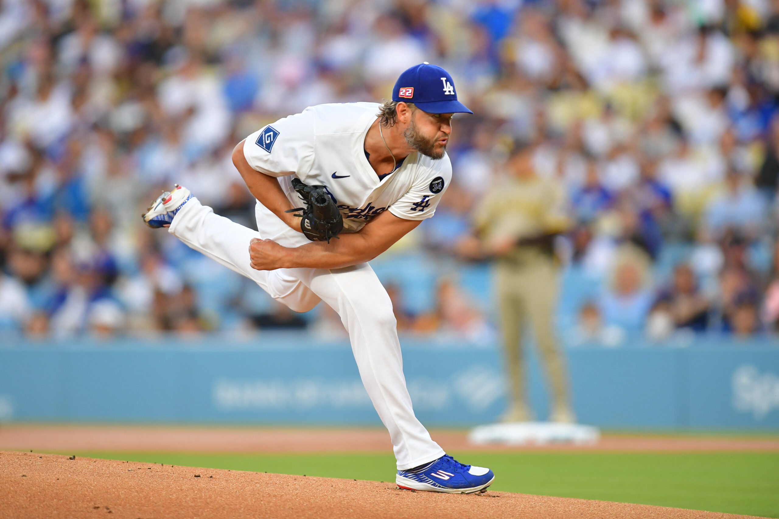 Aug 15, 2025; Los Angeles, California, USA;  Los Angeles Dodgers pitcher Clayton Kershaw (22) throws against the San Diego Padres during the first inning at Dodger Stadium. Mandatory Credit: Gary A. Vasquez-Imagn Images