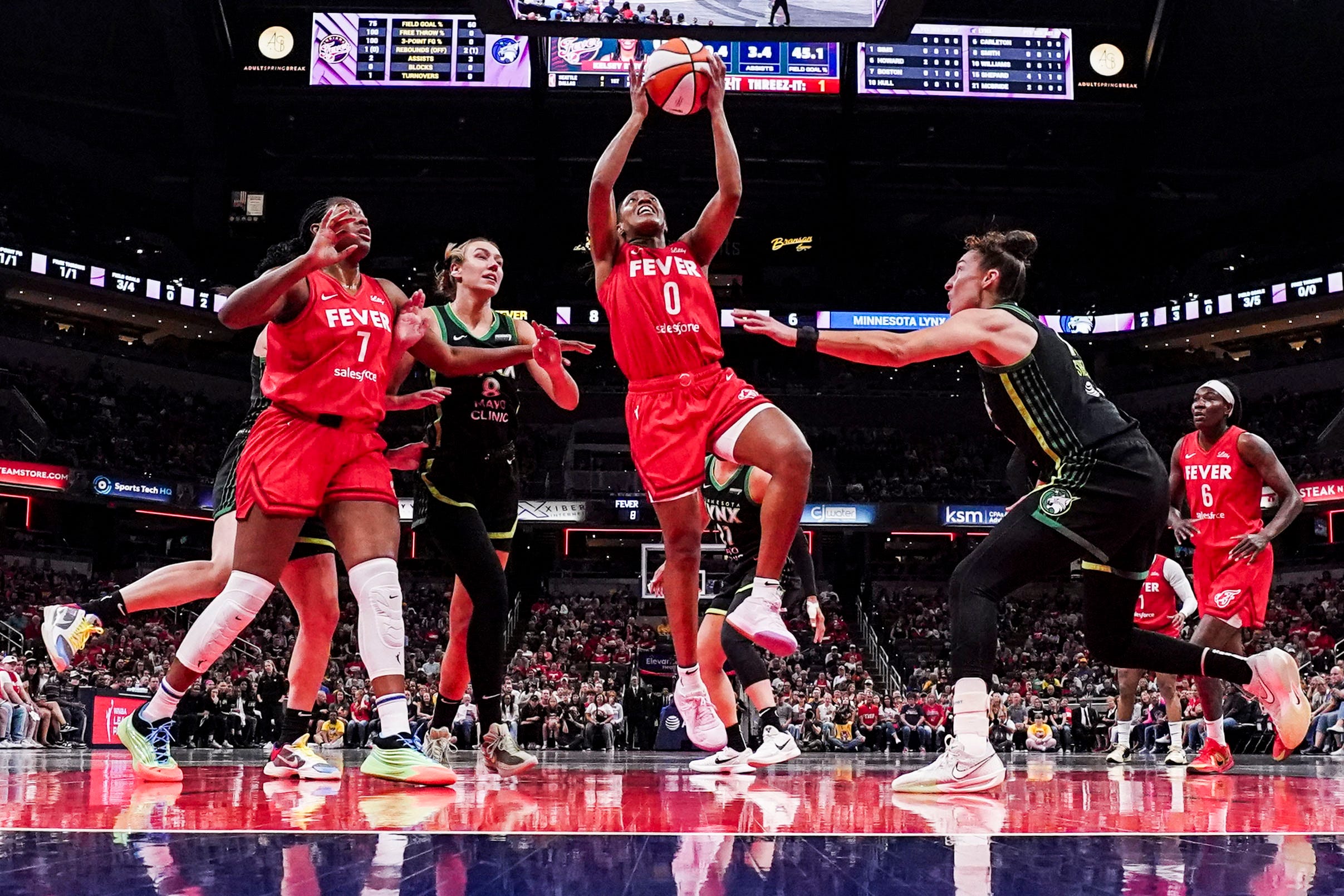 Indiana Fever guard Kelsey Mitchell (0) goes up for a basket Friday, Aug. 22, 2025, during a game between the Indiana Fever and the Minnesota Lynx at Gainbridge Fieldhouse in Indianapolis. The Minnesota Lynx defeated the Indiana Fever, 95-90.