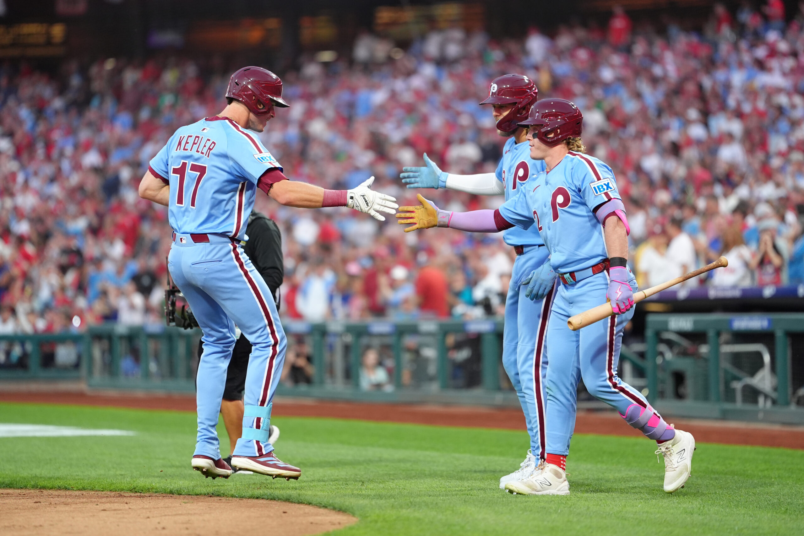 Aug 28, 2025; Philadelphia, Pennsylvania, USA; Philadelphia Phillies outfielder Max Kepler (17) reacts with outfielder Harrison Bader (2) and infielder Alec Bohm (28) after hitting a two-run home run against the Atlanta Braves in the first inning at Citizens Bank Park. Mandatory Credit: Kyle Ross-Imagn Images