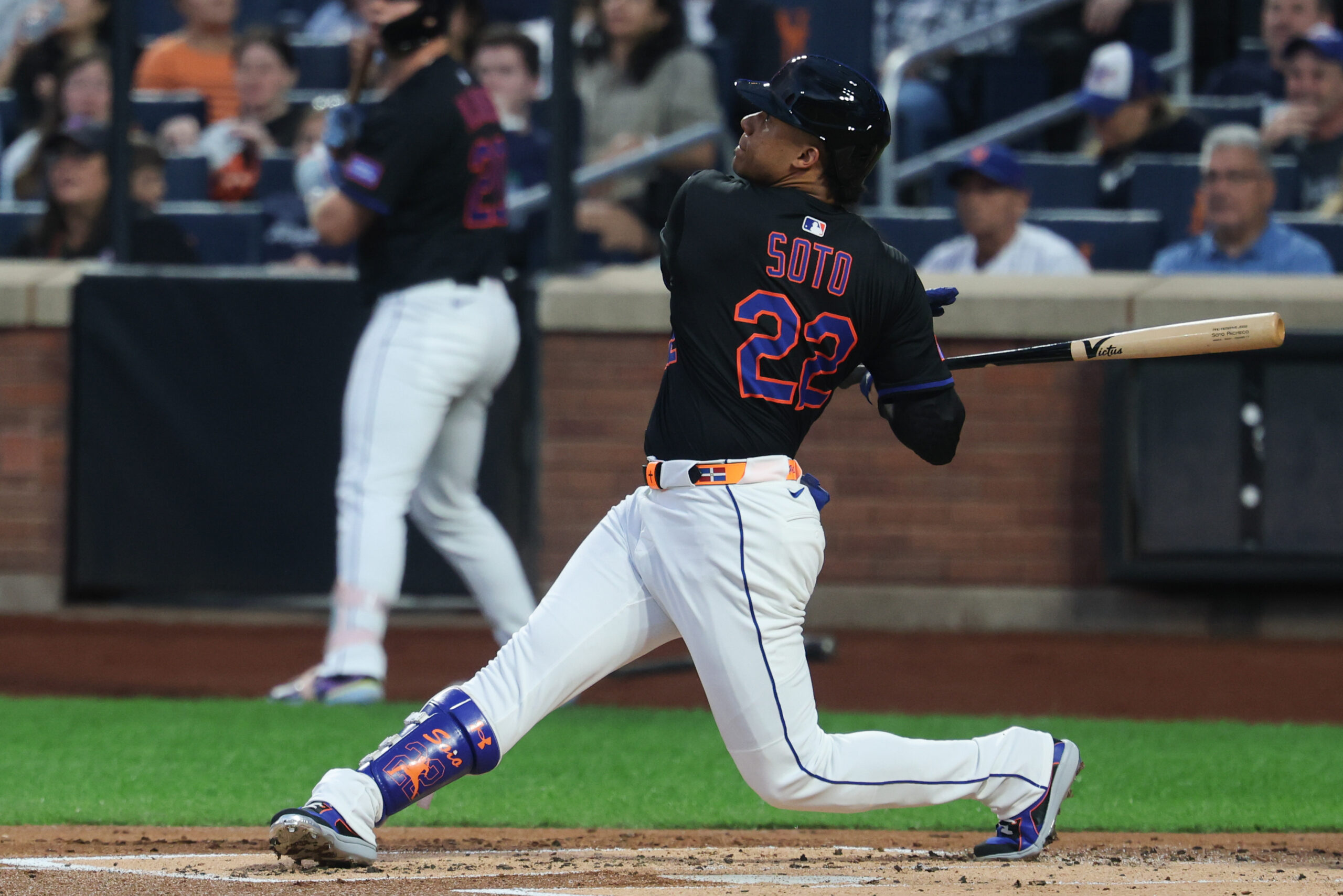 Aug 29, 2025; New York City, New York, USA; New York Mets right fielder Juan Soto (22) hits a two run home run during the first inning against the Miami Marlins at Citi Field. Mandatory Credit: Vincent Carchietta-Imagn Images
