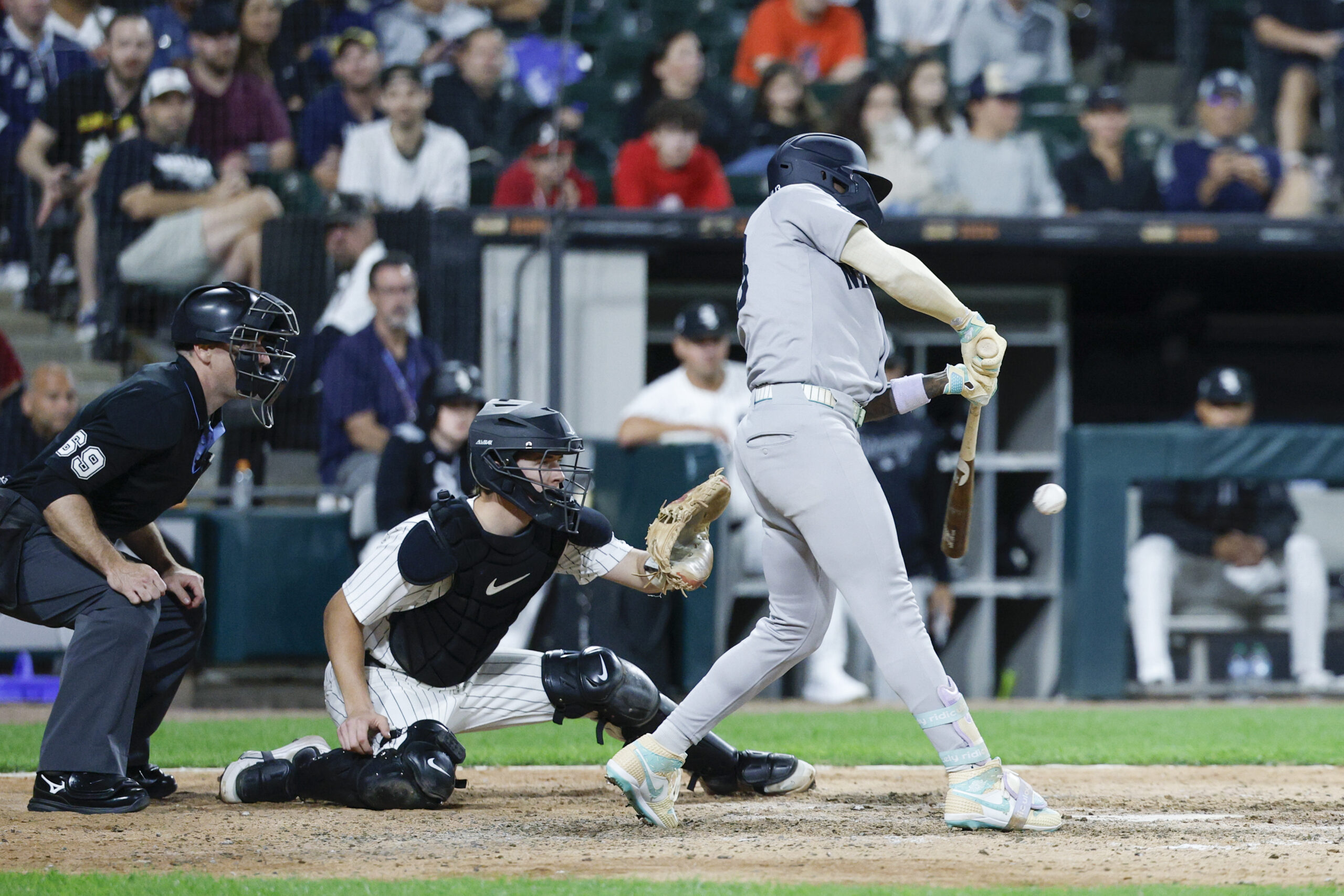 Aug 30, 2025; Chicago, Illinois, USA; New York Yankees second baseman Jazz Chisholm Jr. (13) hits one-run double against the Chicago White Sox during the 11th inning at Rate Field. Mandatory Credit: Kamil Krzaczynski-Imagn Images