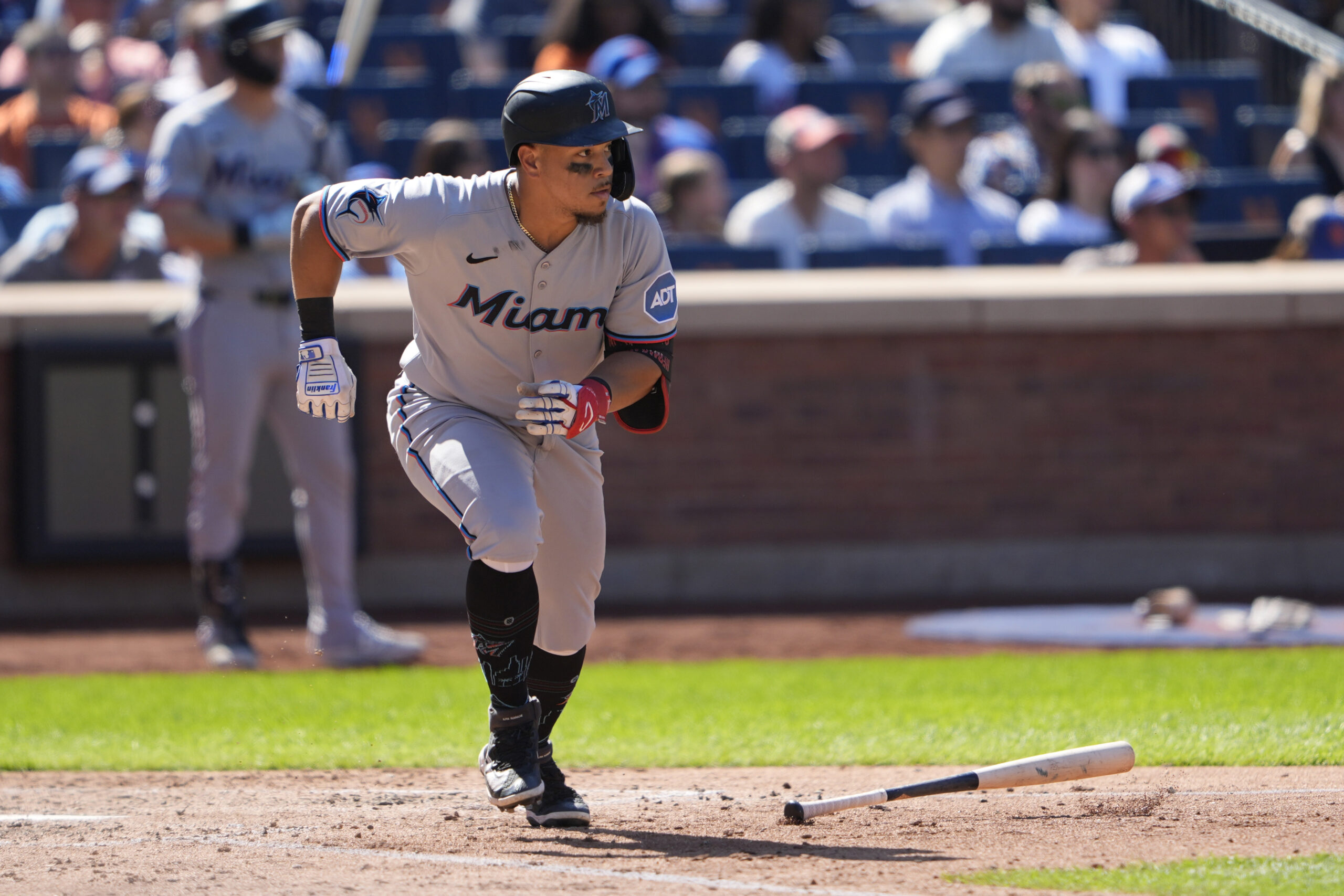 Aug 31, 2025; New York City, New York, USA; Miami Marlins left fielder Heriberto Hernandez (64) runs out a single against the New York Mets during the sixth inning at Citi Field. Mandatory Credit: Gregory Fisher-Imagn Images