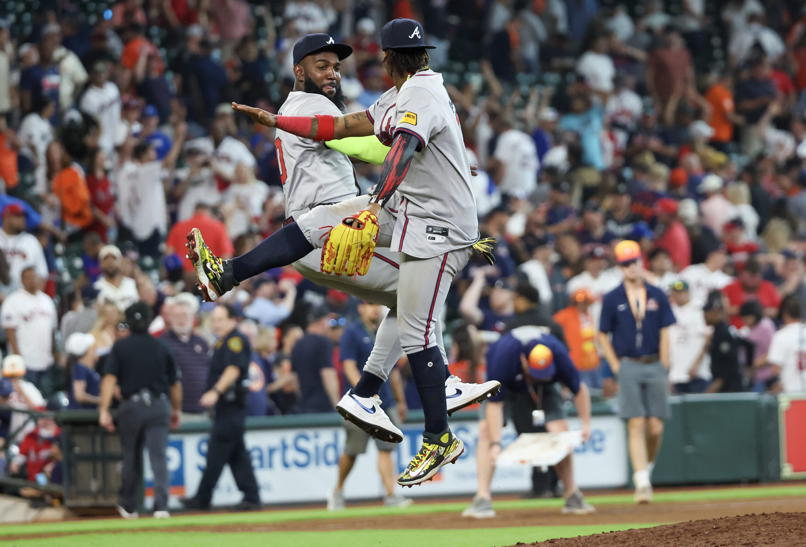 Apr 17, 2024; Houston, Texas, USA;Atlanta Braves designated hitter Marcell Ozuna (20) and right fielder Ronald Acuna Jr. (13) celebrate the win against the Houston Astros  Minute Maid Park. Mandatory Credit: Thomas Shea-Imagn Images