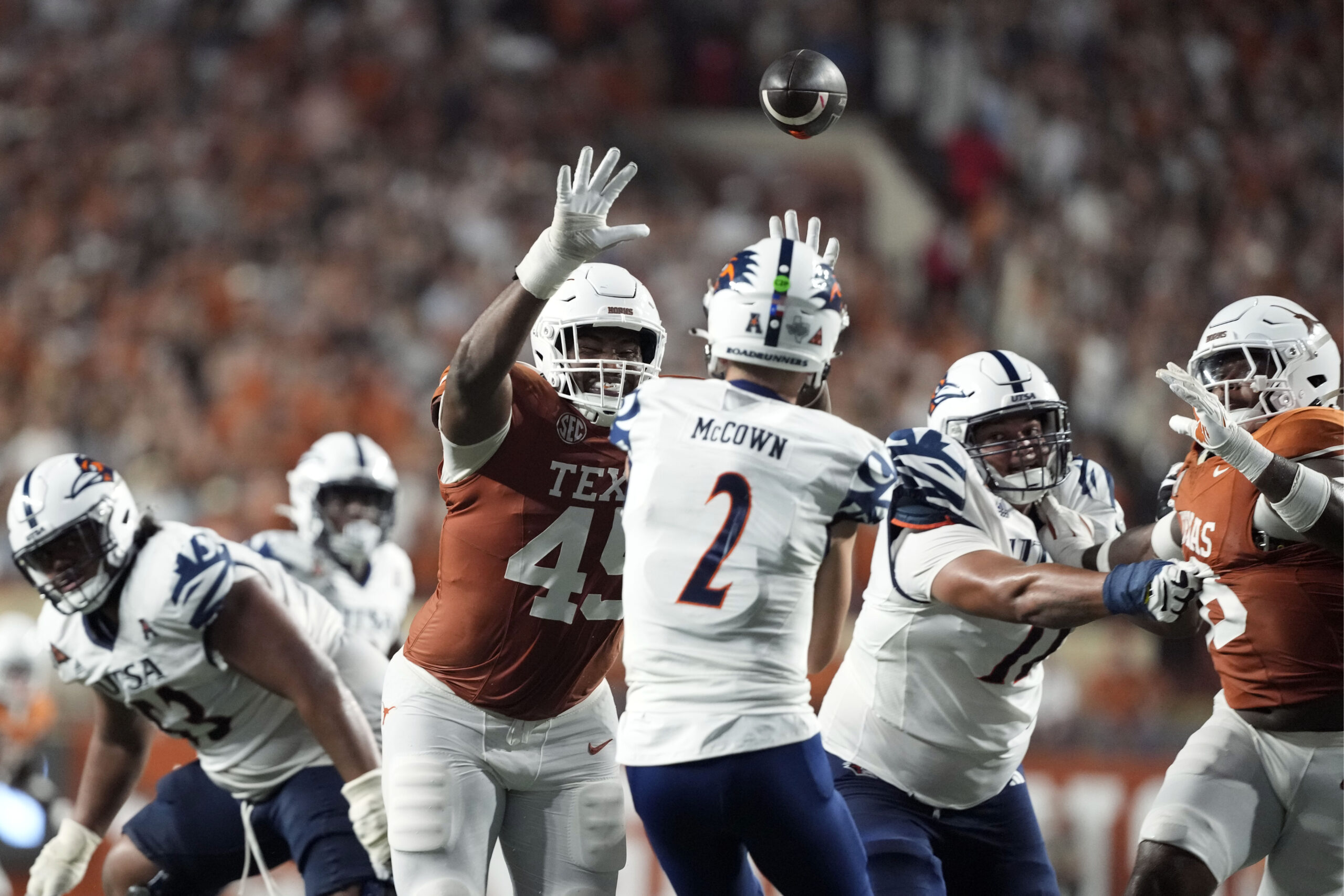 Sep 14, 2024; Austin, Texas, USA; Texas Longhorns defensive lineman Vernon Broughton (45) defends a pass by Texas-San Antonio Roadrunners quarterback Owen McCown (2) during the second half at Darrell K Royal-Texas Memorial Stadium. Mandatory Credit: Scott Wachter-Imagn Images