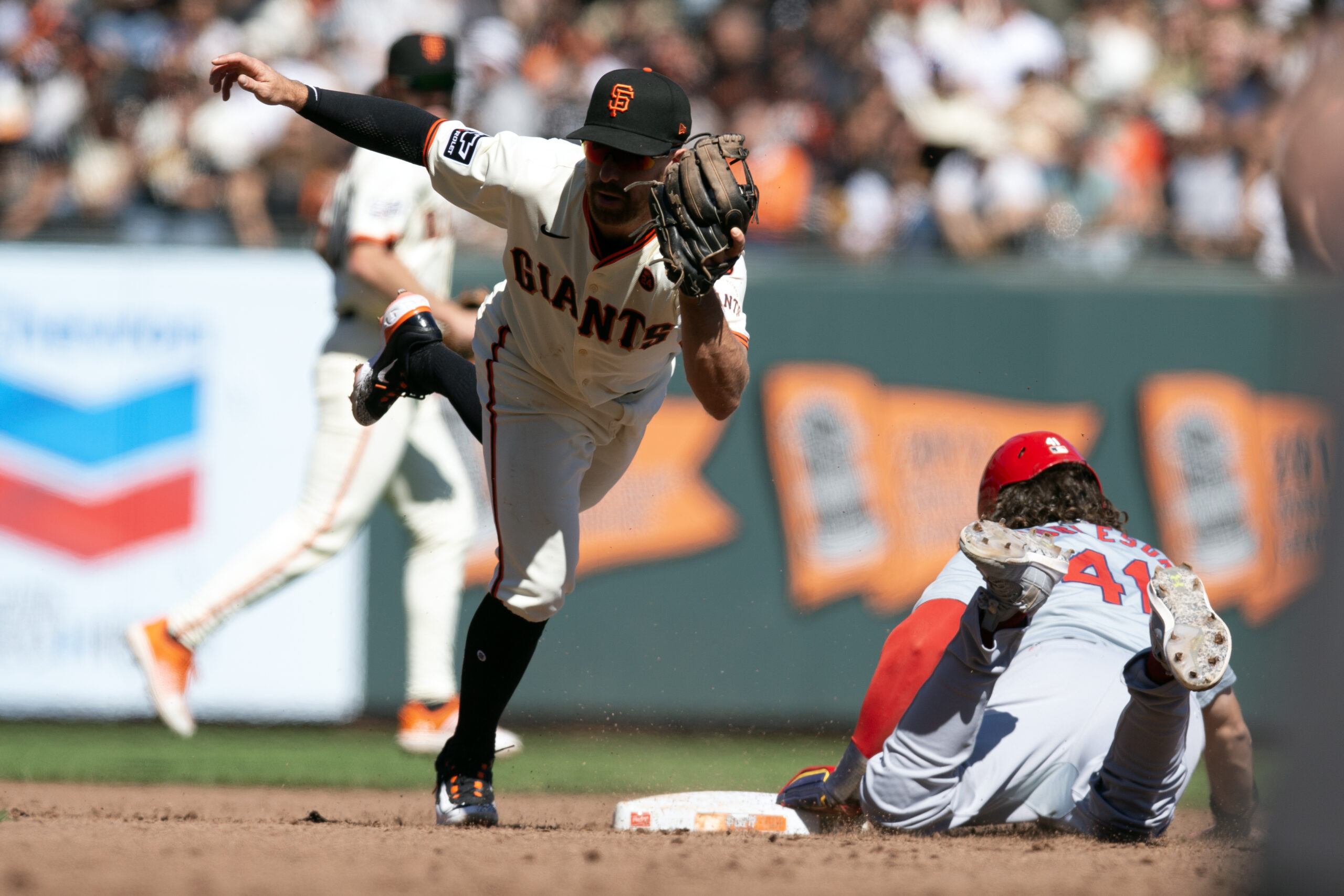 Sep 29, 2024; San Francisco, California, USA; San Francisco Giants second baseman Donovan Walton (18) tags out St. Louis Cardinals center fielder Alec Burleson (41) on an attempted steal during the sixth inning at Oracle Park. Mandatory Credit: D. Ross Cameron-Imagn Images