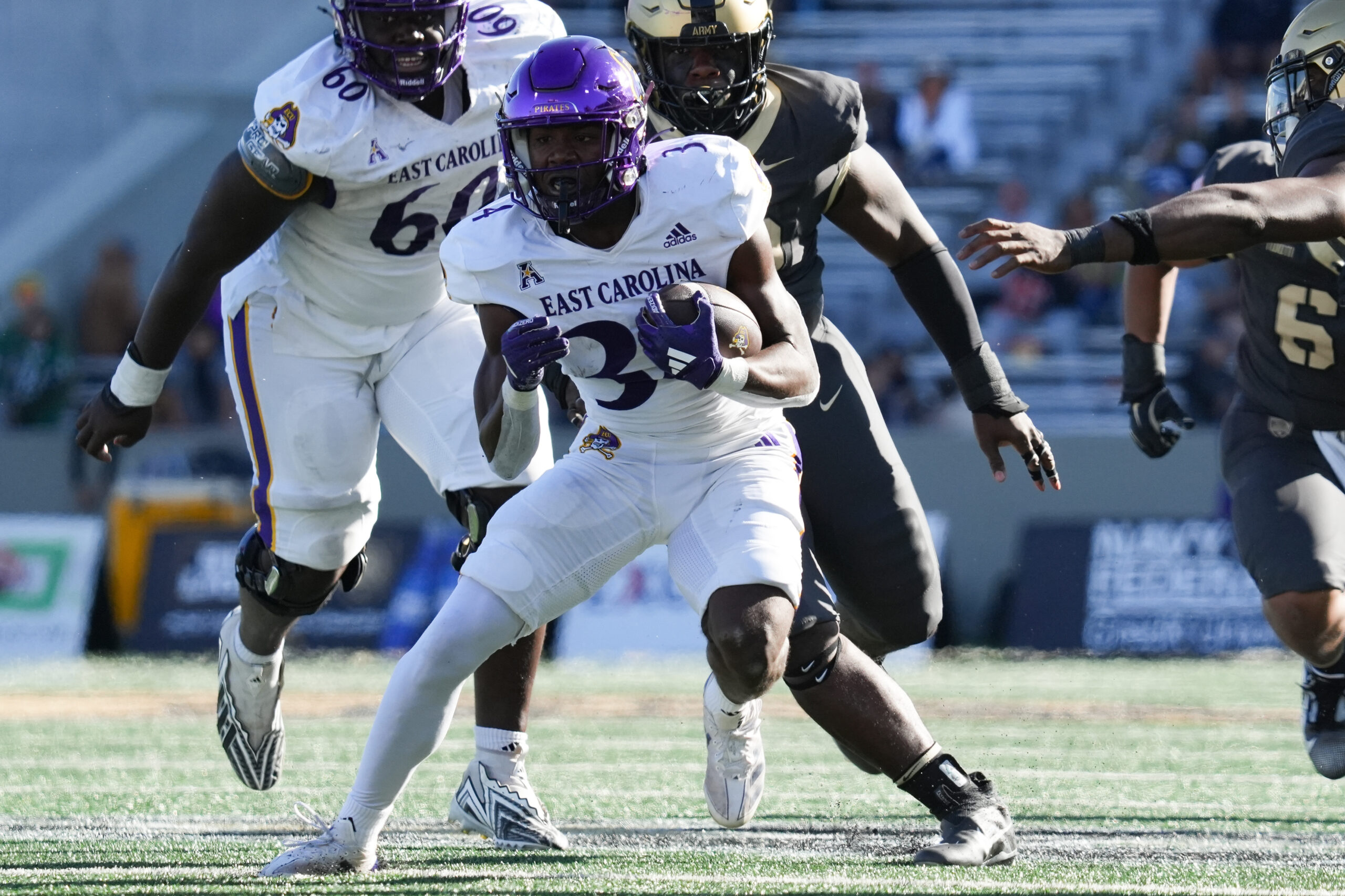 Oct 19, 2024; West Point, New York, USA; East Carolina Pirates running back London Montgomery (34) carries during the second half against the Army Black Knights at Michie Stadium. Mandatory Credit: Lucas Boland-Imagn Images
