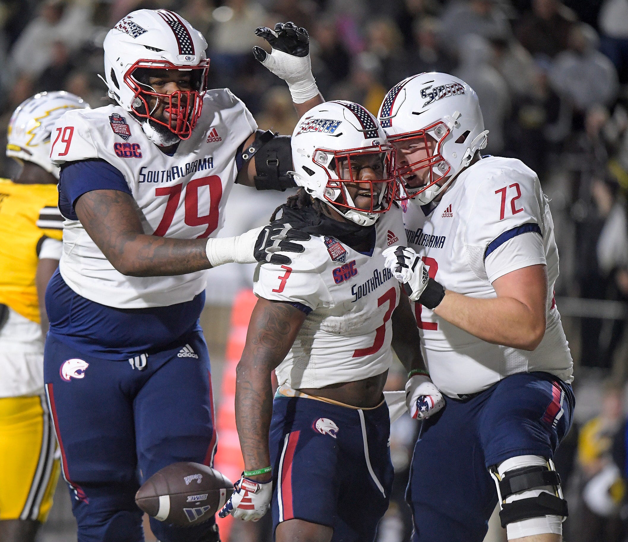 Salute to Veterans Bowl (Dec. 14): South Alabama running back Kentrel Bullock (3) is congratulated on his touchdown run by teammates during the Salute to Veterans Bowl held at Cramton Bowl in Montgomery, Alabama. South Alabama won the game, 30-23.