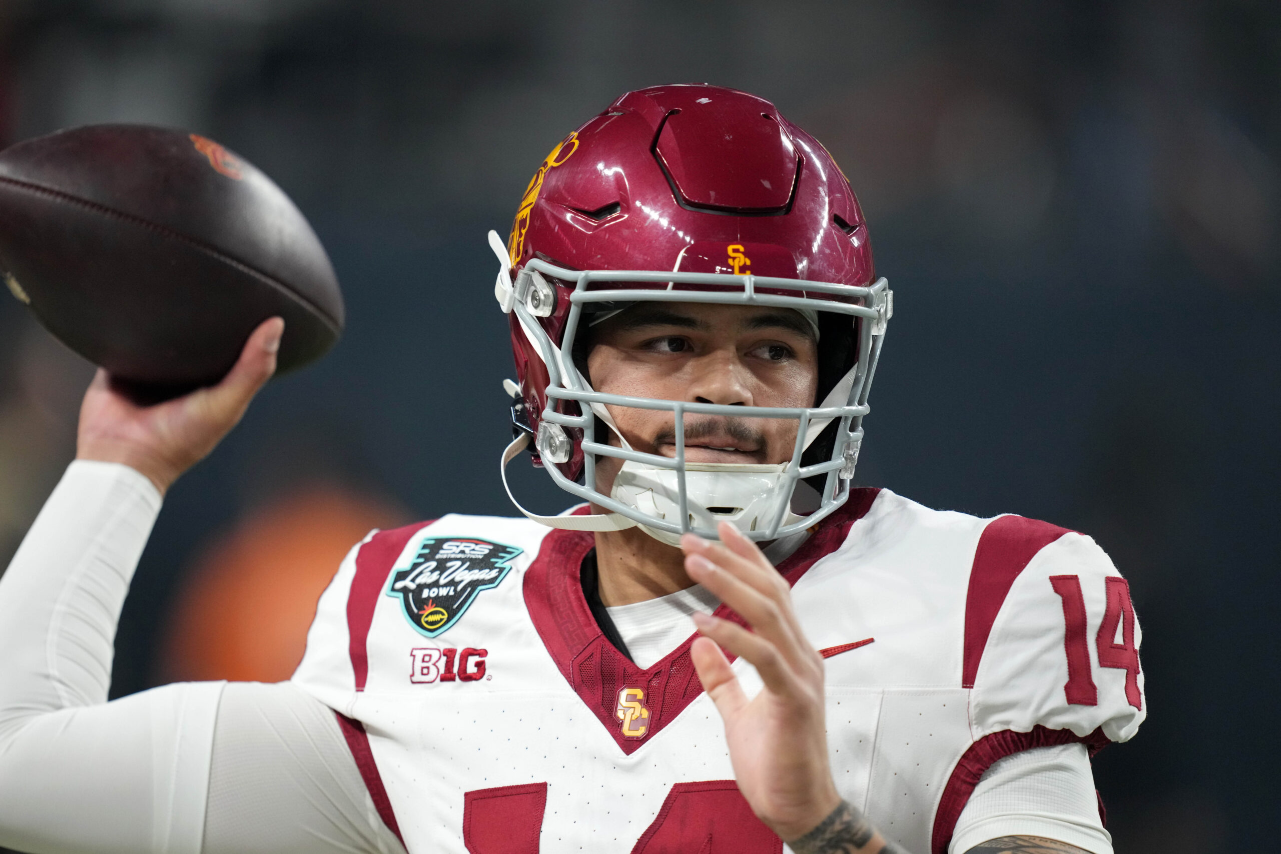 Dec 27, 2024; Las Vegas, NV, USA; Southern California Trojans quarterback Jayden Maiava (14) throws the ball against the Texas A&M Aggies in the first half at Allegiant Stadium. Mandatory Credit: Kirby Lee-Imagn Images
