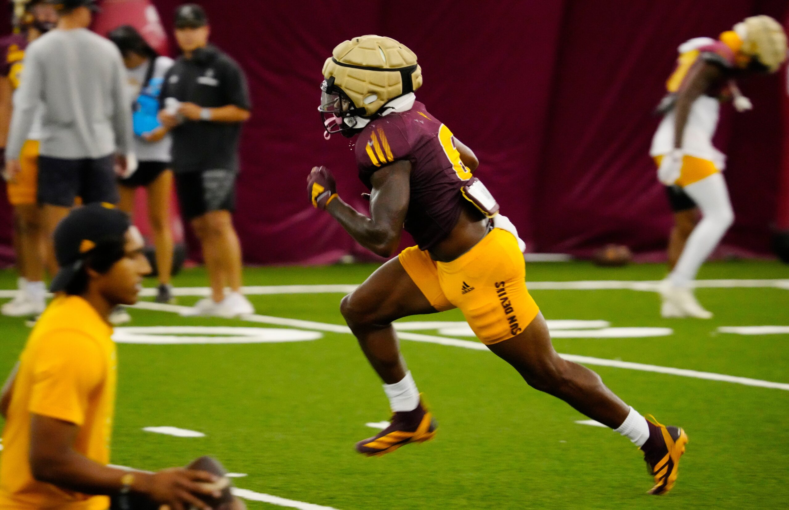 Arizona State running back Kanye Udoh (6) runs in a drill during a practice inside the Verde Dickey Dome in Tempe on Aug. 12, 2025.