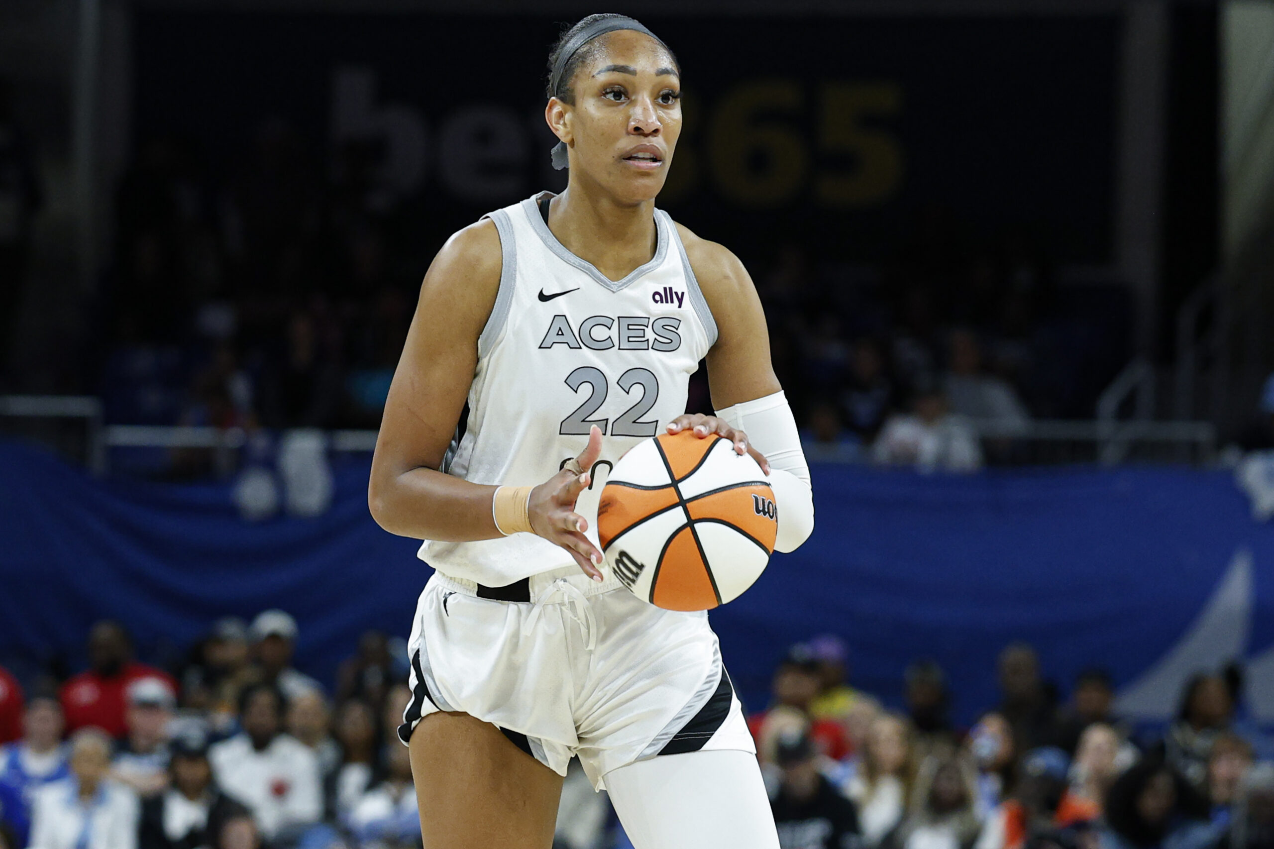 Aug 25, 2025; Chicago, Illinois, USA; Las Vegas Aces center A'ja Wilson (22) brings the ball up court during the second half of a WNBA game against the Chicago Sky at Wintrust Arena. Mandatory Credit: Kamil Krzaczynski-Imagn Images