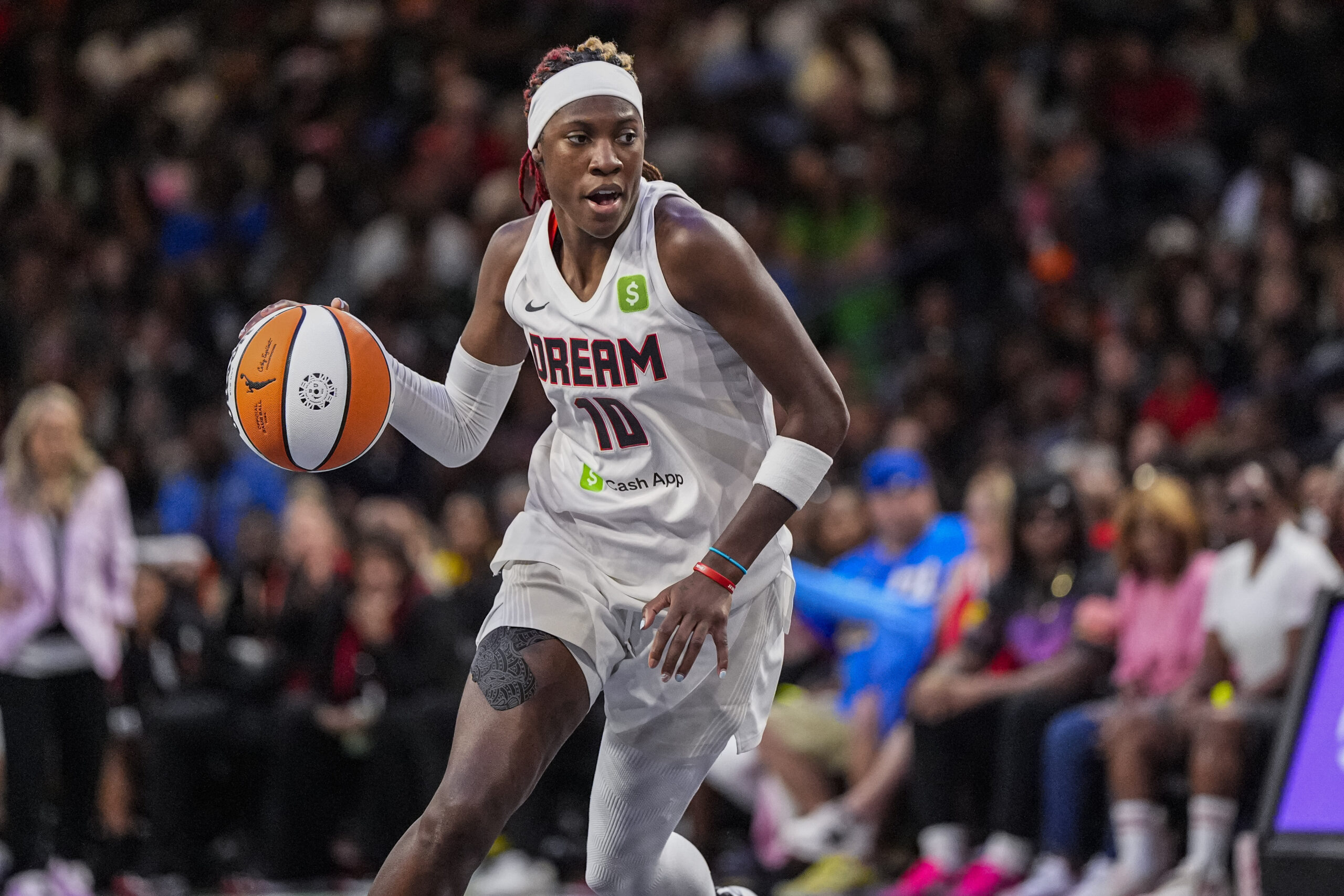 Aug 27, 2025; College Park, Georgia, USA; Atlanta Dream guard Rhyne Howard (10) controls the ball against the Las Vegas Aces during the second half at Gateway Center Arena at College Park. Mandatory Credit: Dale Zanine-Imagn Images
