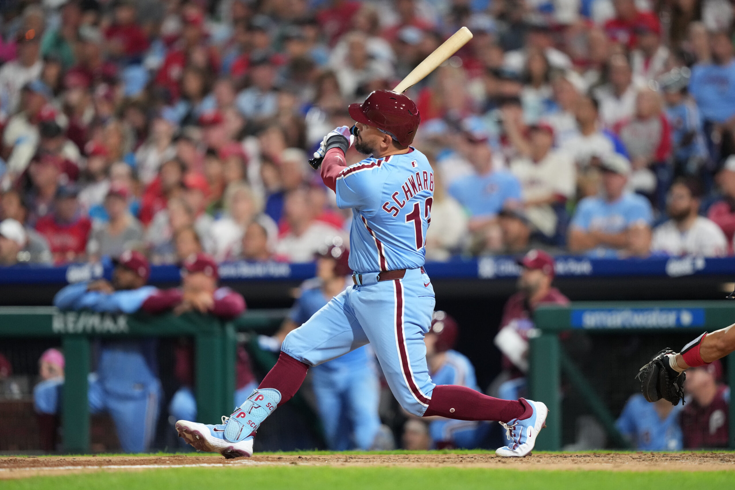 Aug 28, 2025; Philadelphia, Pennsylvania, USA; Philadelphia Phillies designated hitter Kyle Schwarber (12) hits a two-run home run against the Atlanta Braves in the fourth inning at Citizens Bank Park. Mandatory Credit: Kyle Ross-Imagn Images