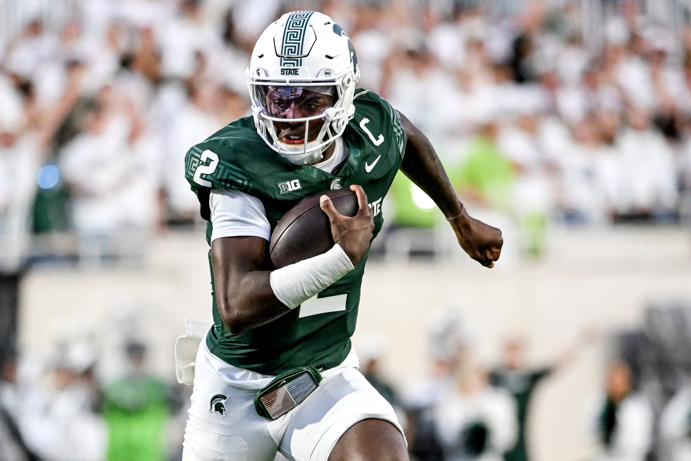 Michigan State's Aidan Chiles runs for a gain against Western Michigan during the second quarter on Friday, Aug. 29, 2025, in East Lansing.