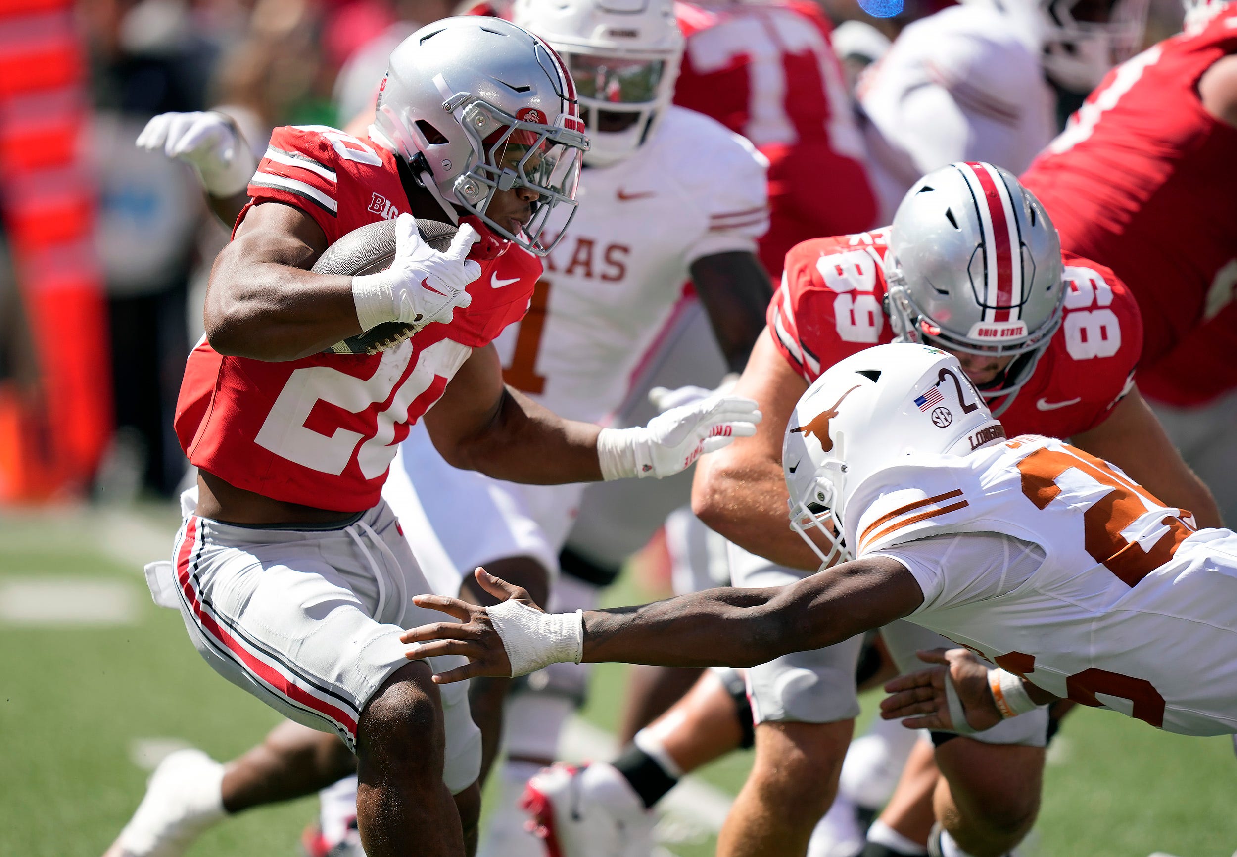 Ohio State Buckeyes running back James Peoples (20) makes Texas Longhorns linebacker Ty'Anthony Smith (26) miss while running the ball in the fourth quarter of their game at Ohio Stadium in Columbus, Ohio on Aug 30, 2025.