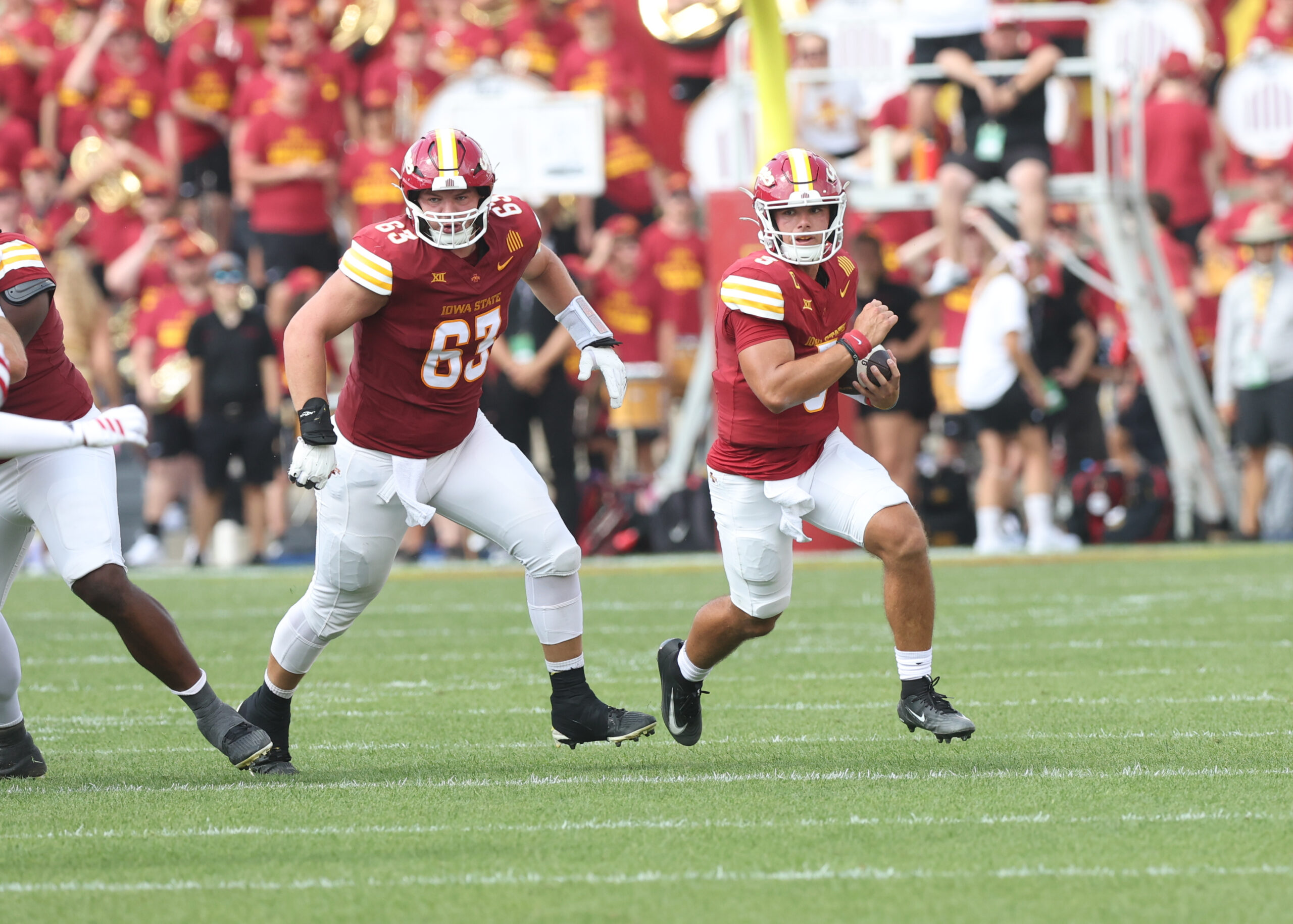 Aug 30, 2025; Ames, Iowa, USA; Iowa State Cyclones offensive lineman Jim Bonifas (63) blocks for Iowa State Cyclones quarterback Rocco Becht (3) against the South Dakota Coyotes at Jack Trice Stadium. Mandatory Credit: Reese Strickland-Imagn Images