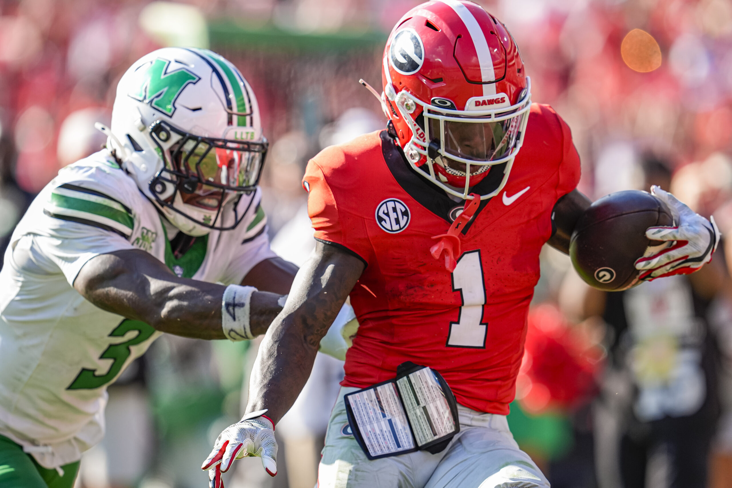 Aug 30, 2025; Athens, Georgia, USA; Georgia Bulldogs wide receiver Zachariah Branch (1) runs past Marshall Thundering Herd defensive back Marvae Myers (3) for a touchdown after catching a pass at Sanford Stadium. Mandatory Credit: Dale Zanine-Imagn Images