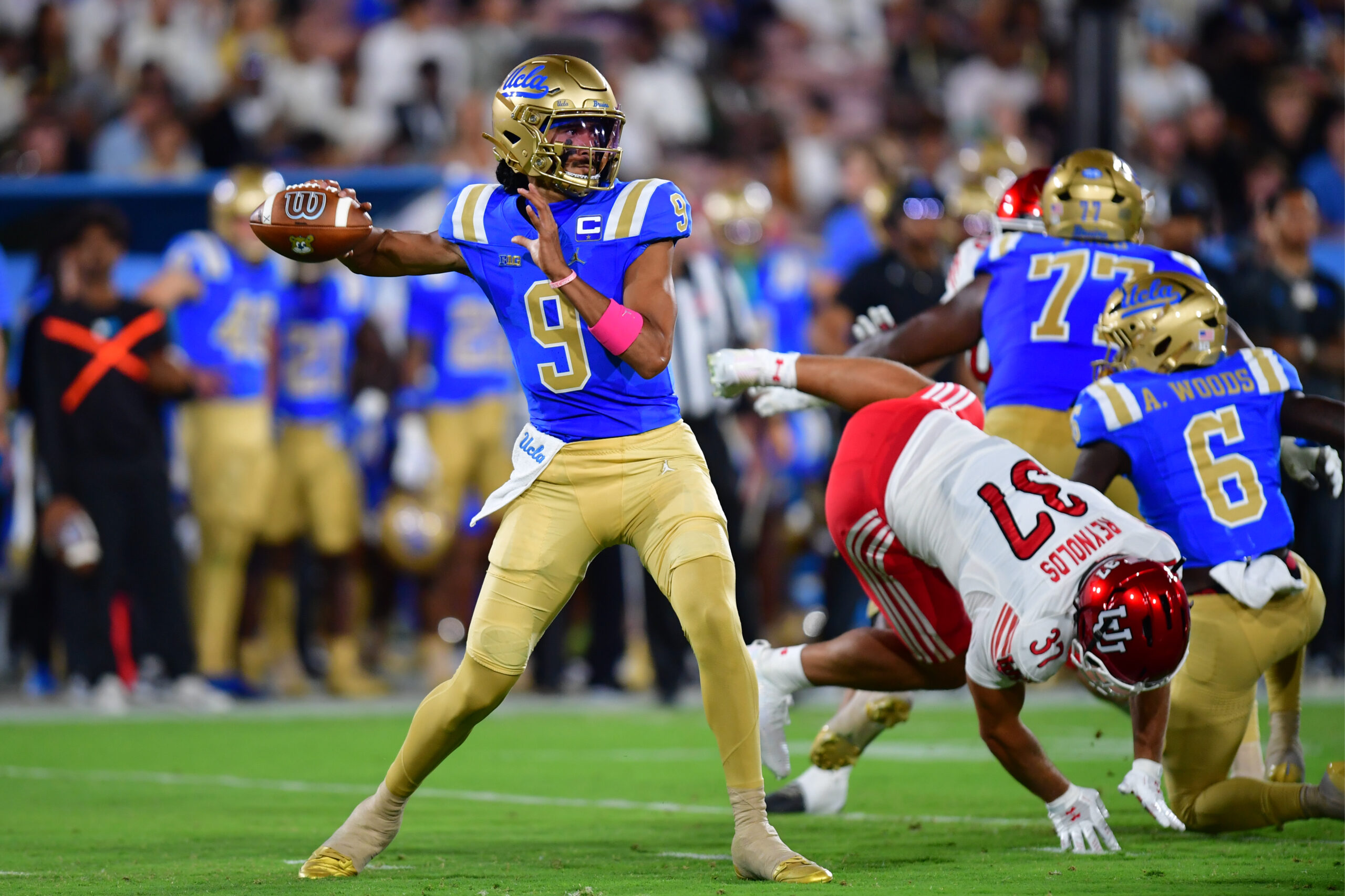 Aug 30, 2025; Pasadena, California, USA;  UCLA Bruins quarterback Nico Iamaleava (9) throws against the against the Utah Utes during the first half at the Rose Bowl. Mandatory Credit: Gary A. Vasquez-Imagn Images