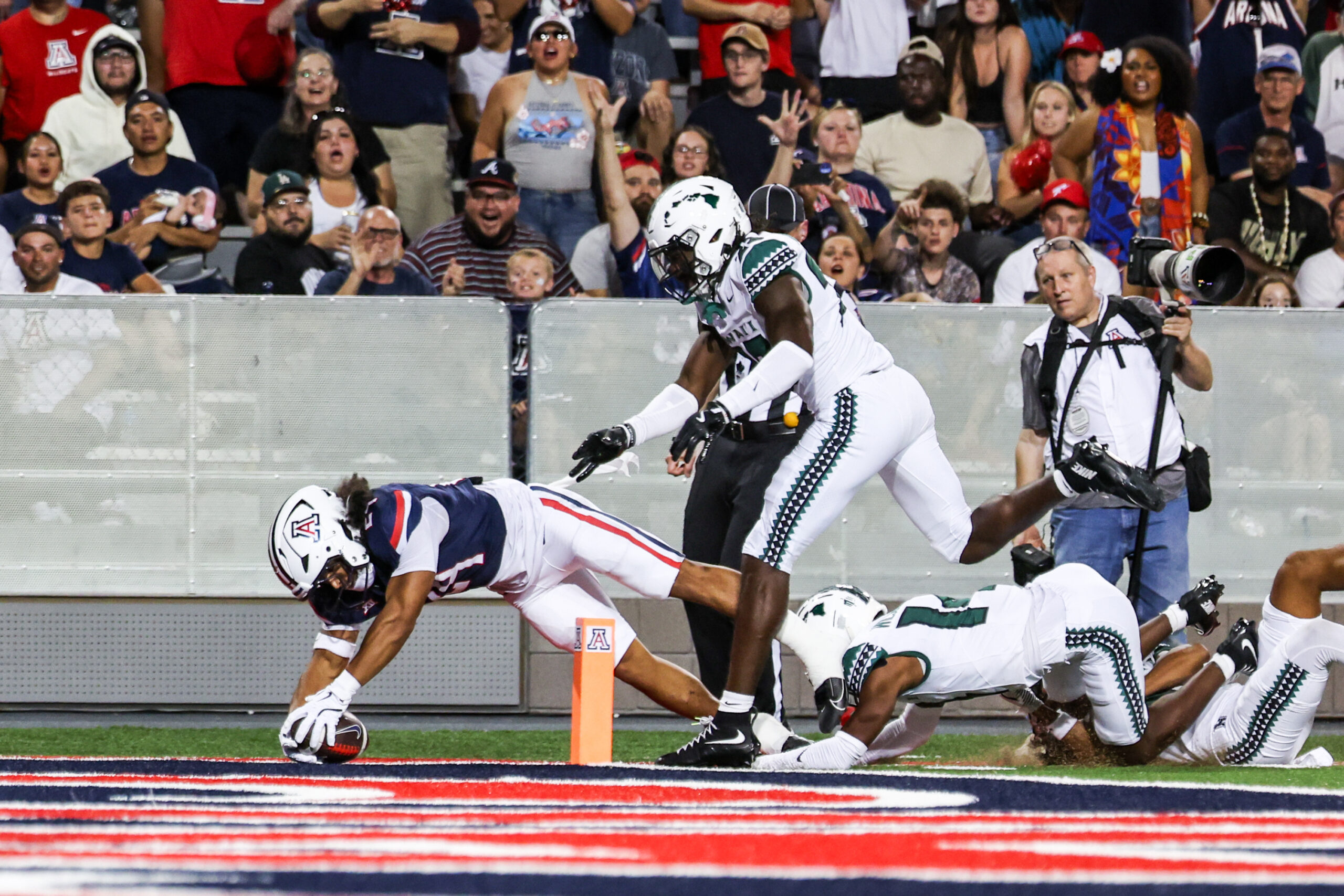 Aug 30, 2025; Tucson, Arizona, USA; Arizona Wildcats running back Quincy Craig (24) drives toward the end zone to score a touchdown during the second quarter against the Hawaii Rainbow Warriors at Arizona Stadium. Mandatory Credit: Aryanna Frank-Imagn Images