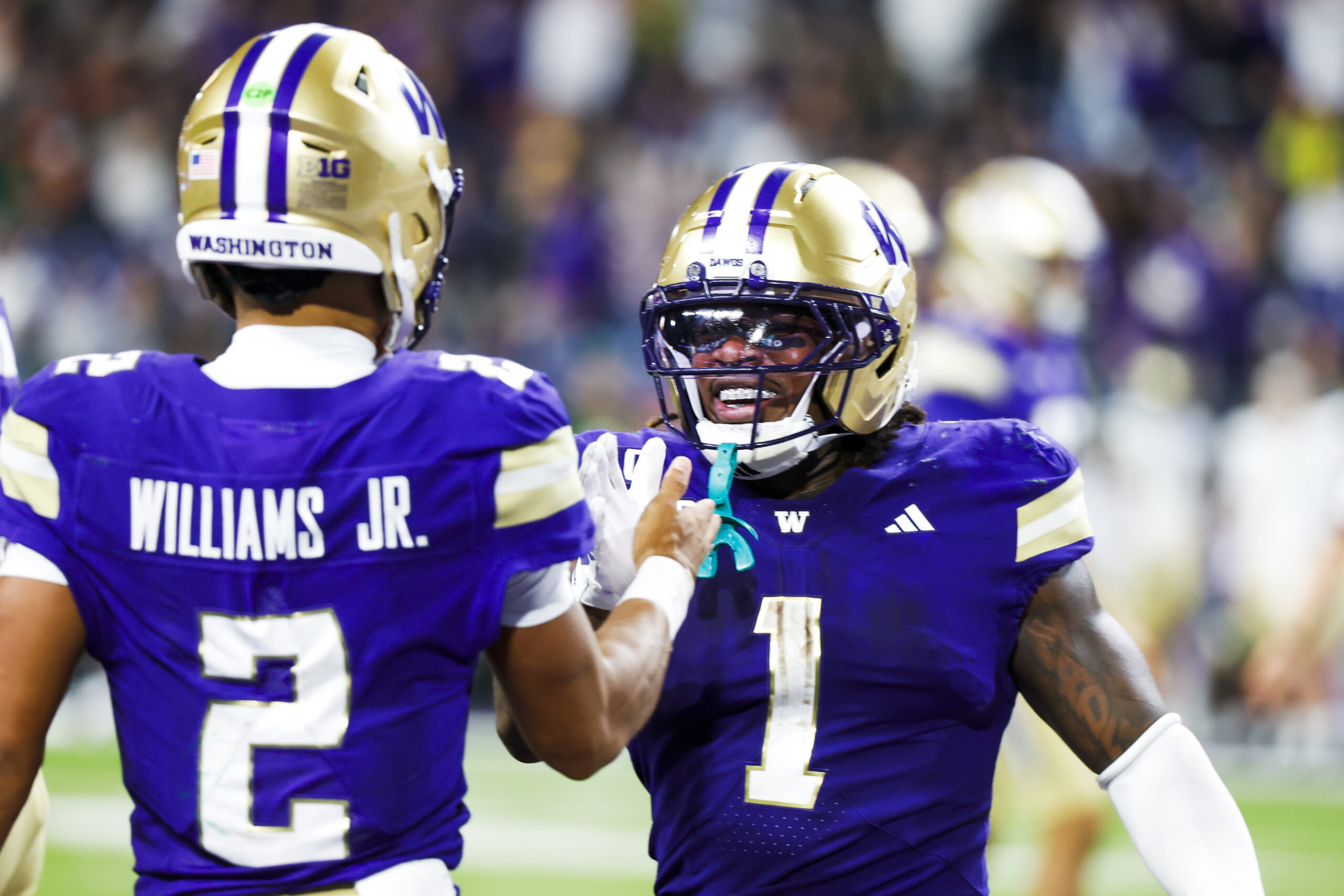 Aug 30, 2025; Seattle, Washington, USA; Washington Huskies running back Jonah Coleman (1) reacts after rushing for a touchdown against the Colorado State Rams during the fourth quarter at Husky Stadium. Mandatory Credit: Joe Nicholson-Imagn Images