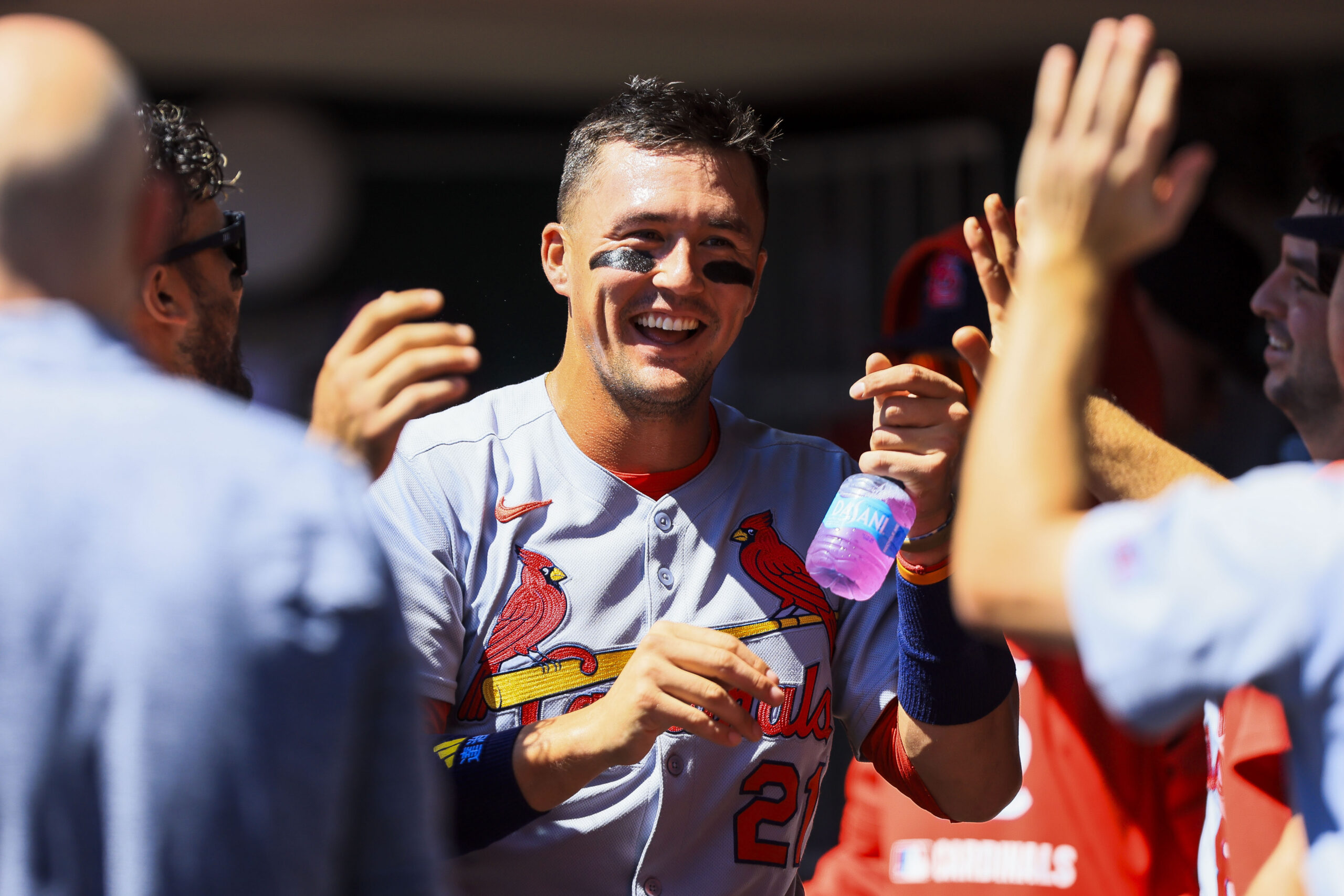 Aug 31, 2025; Cincinnati, Ohio, USA; St. Louis Cardinals outfielder Lars Nootbaar (21) high fives teammates after scoring on a sacrifice fly out hit by designated hitter Ivan Herrera (not pictured) in the third inning against the Cincinnati Reds at Great American Ball Park. Mandatory Credit: Katie Stratman-Imagn Images