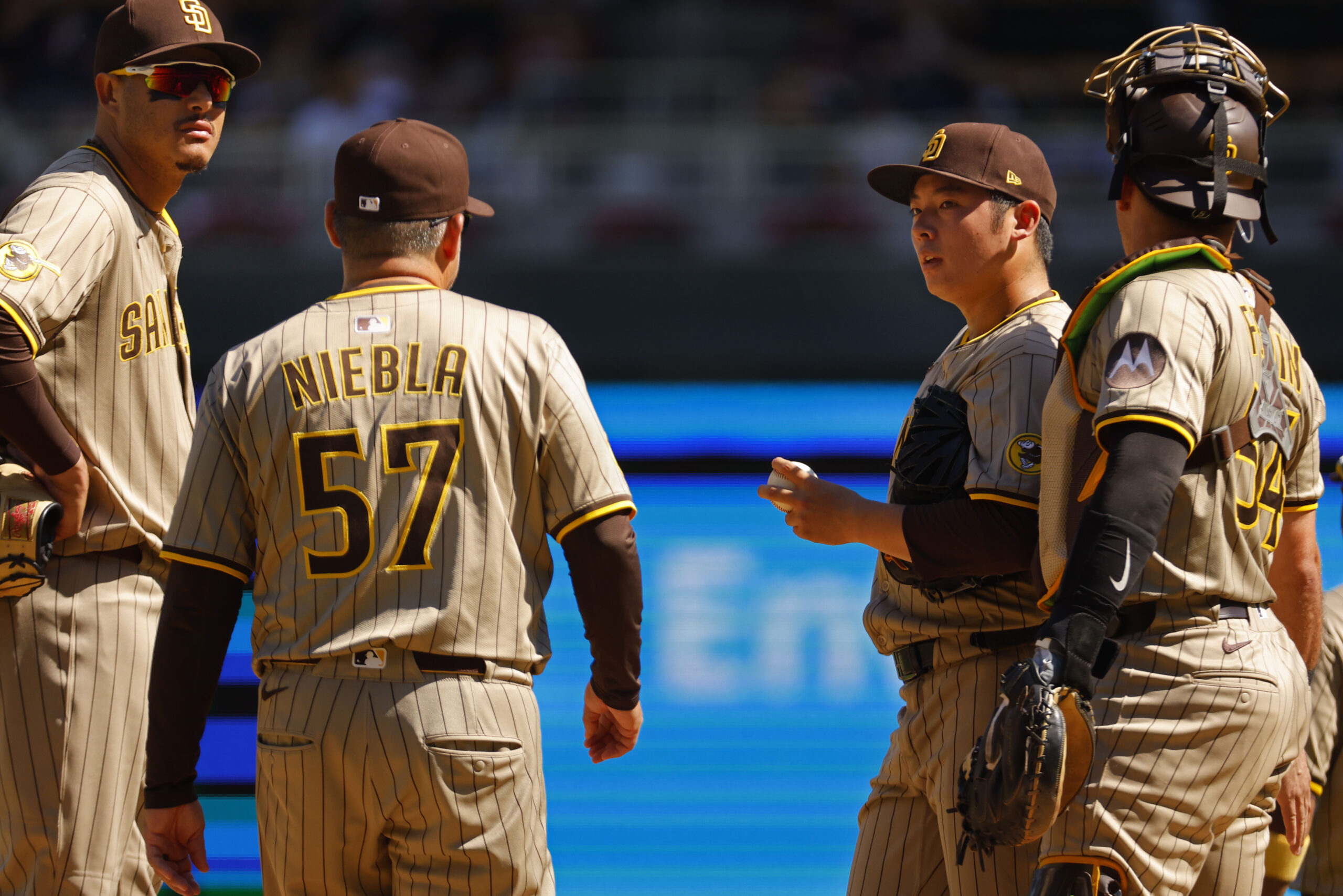 Aug 31, 2025; Minneapolis, Minnesota, USA; San Diego Padres relief pitcher Yuki Matsui (1) awaits pitching coach Ruben Niebla in the seventh inning of the game with the Minnesota Twins at Target Field. Mandatory Credit: Bruce Kluckhohn-Imagn Images