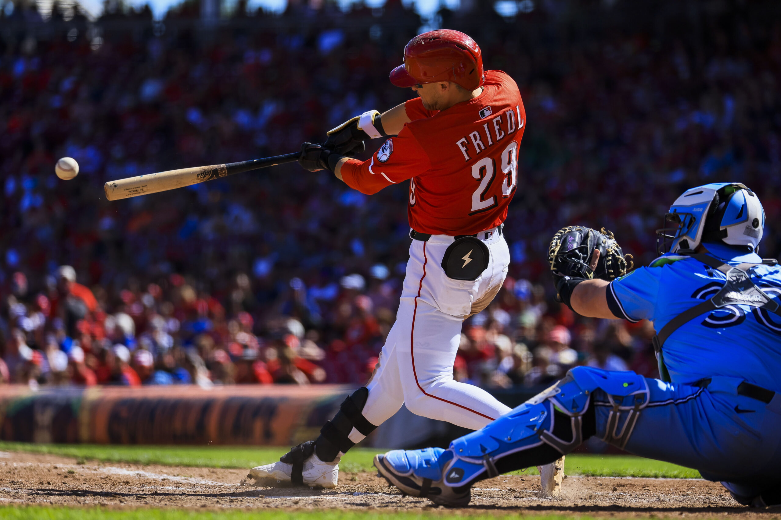 Sep 1, 2025; Cincinnati, Ohio, USA; Cincinnati Reds outfielder TJ Friedl (29) hits a RBI ground-rule double in the ninth inning against the Toronto Blue Jays at Great American Ball Park. Mandatory Credit: Katie Stratman-Imagn Images